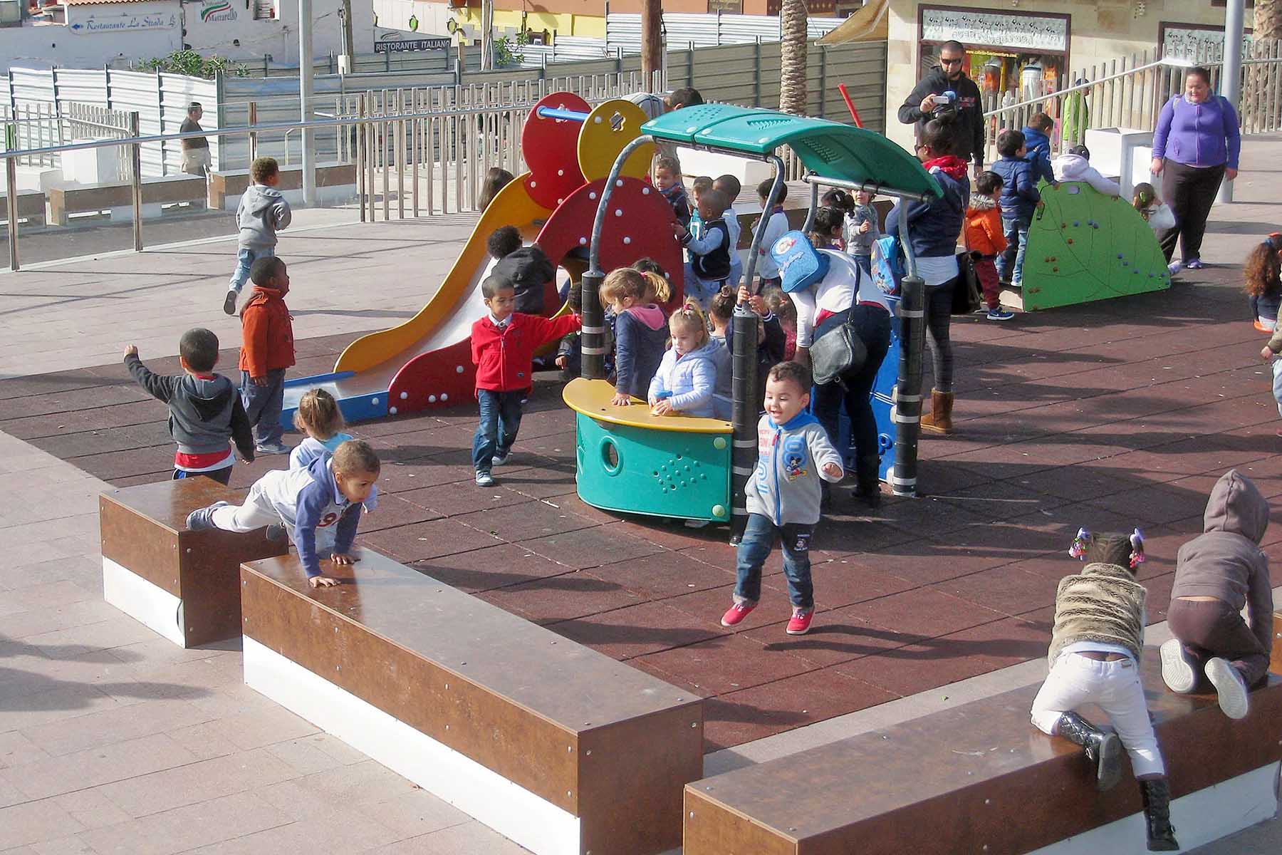 young children playing on a playground in Spain