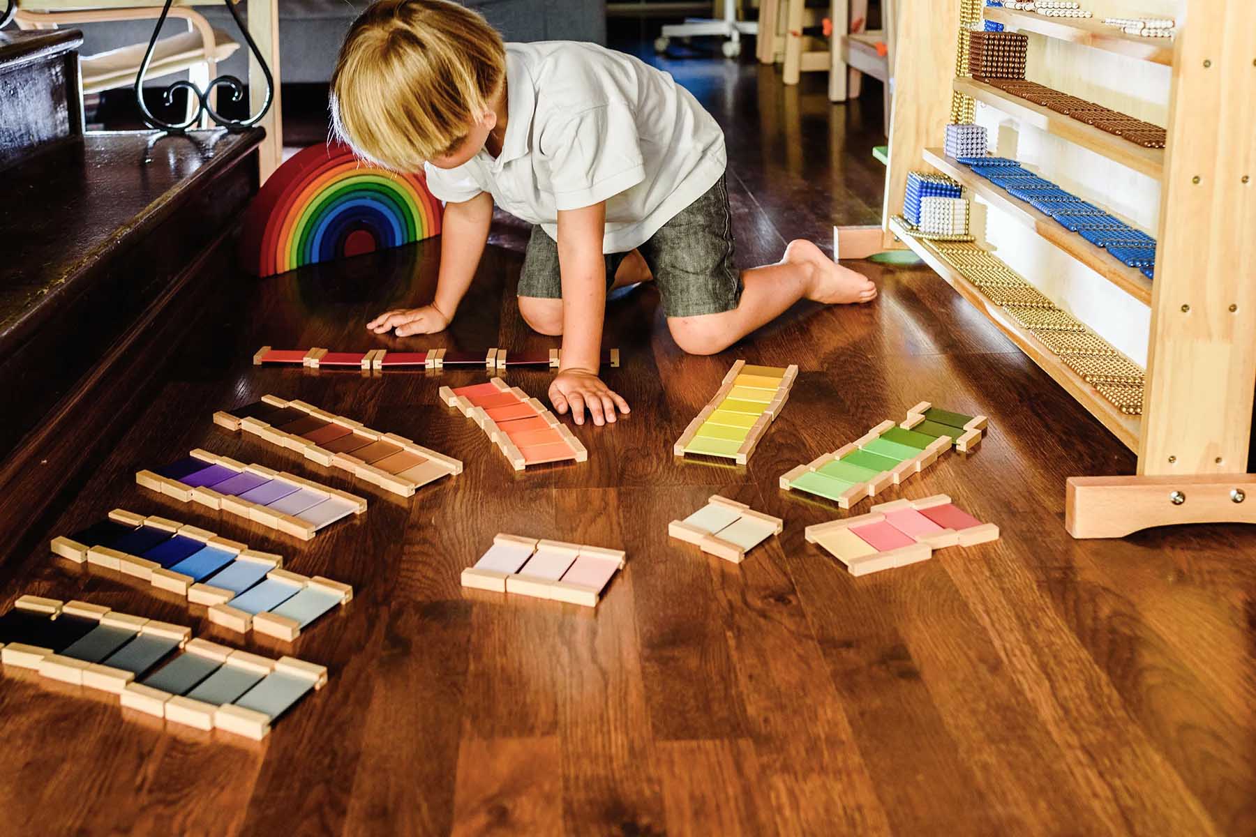 A child playing on the floor of a Montessori school in Spain