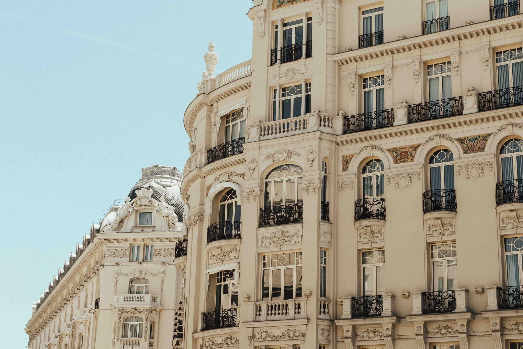 Cream-colored old-fashioned apartment façades in Madrid