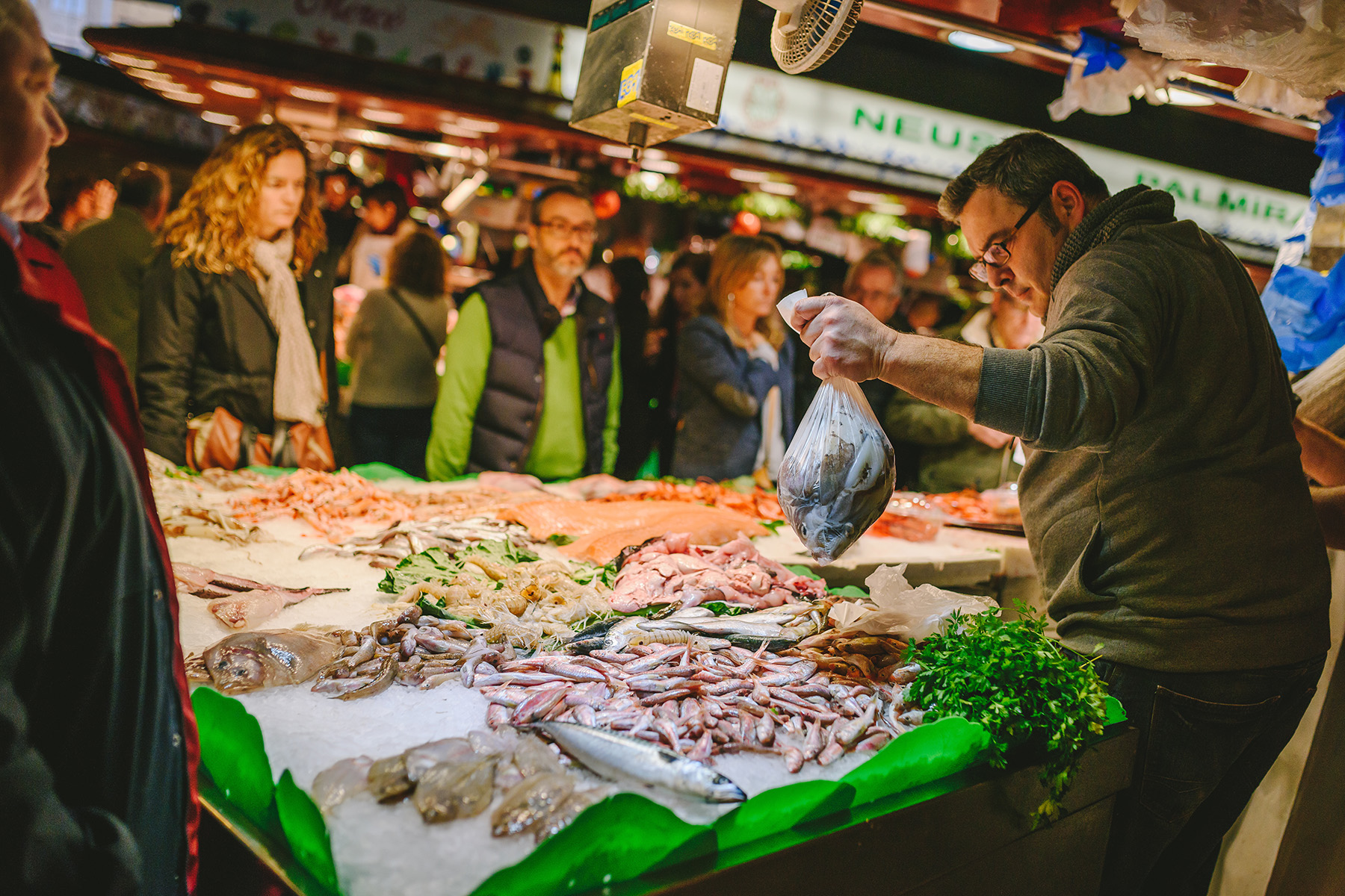 A fishmonger at La Boqueria in Barcelona