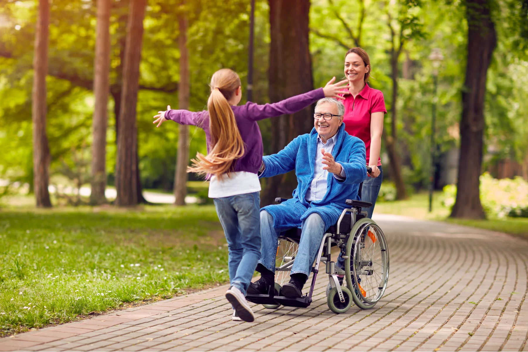 Grandparent in wheelchair meeting his grandchild in Spanish park