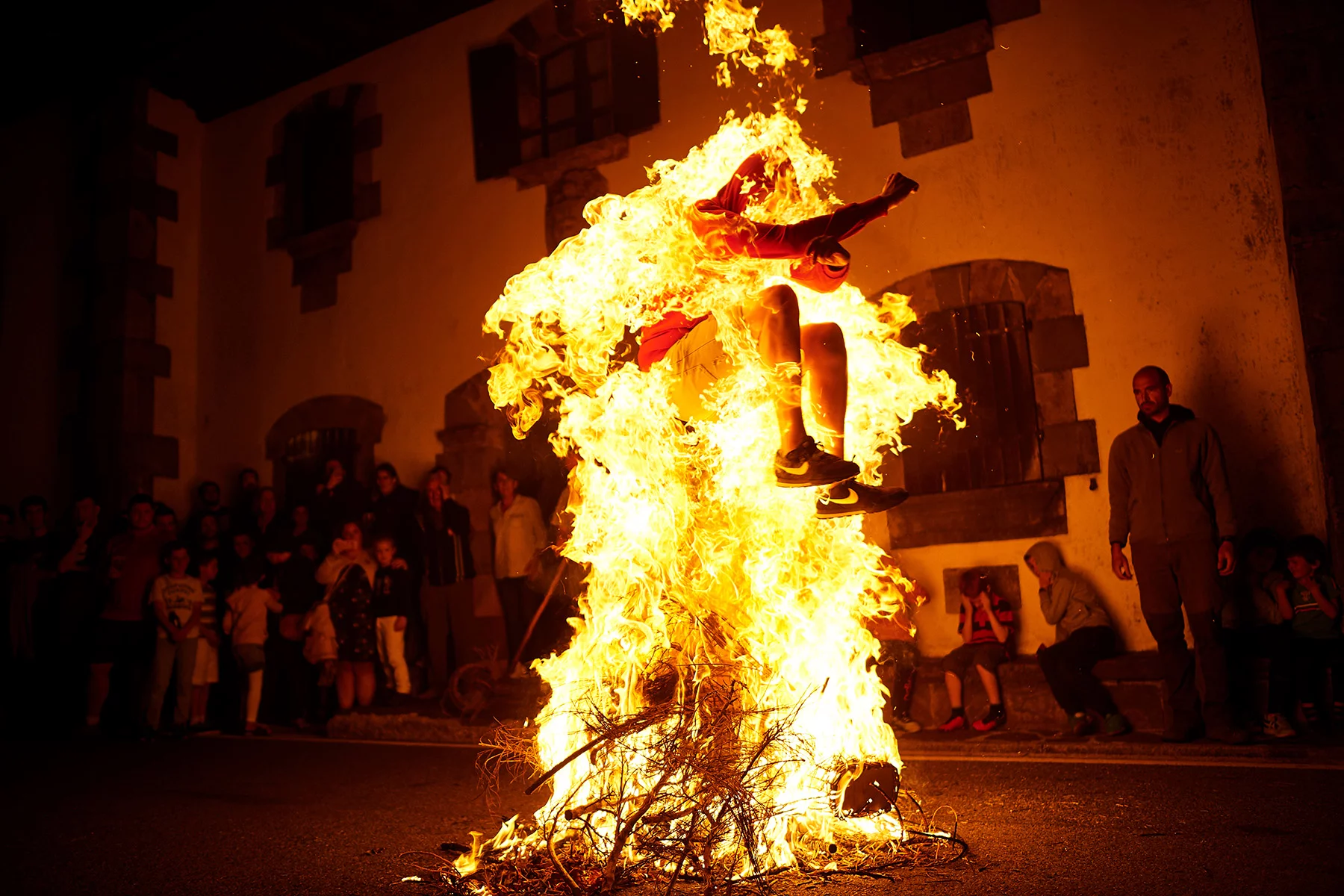 jumping through a bonfire in Navarra, Spain