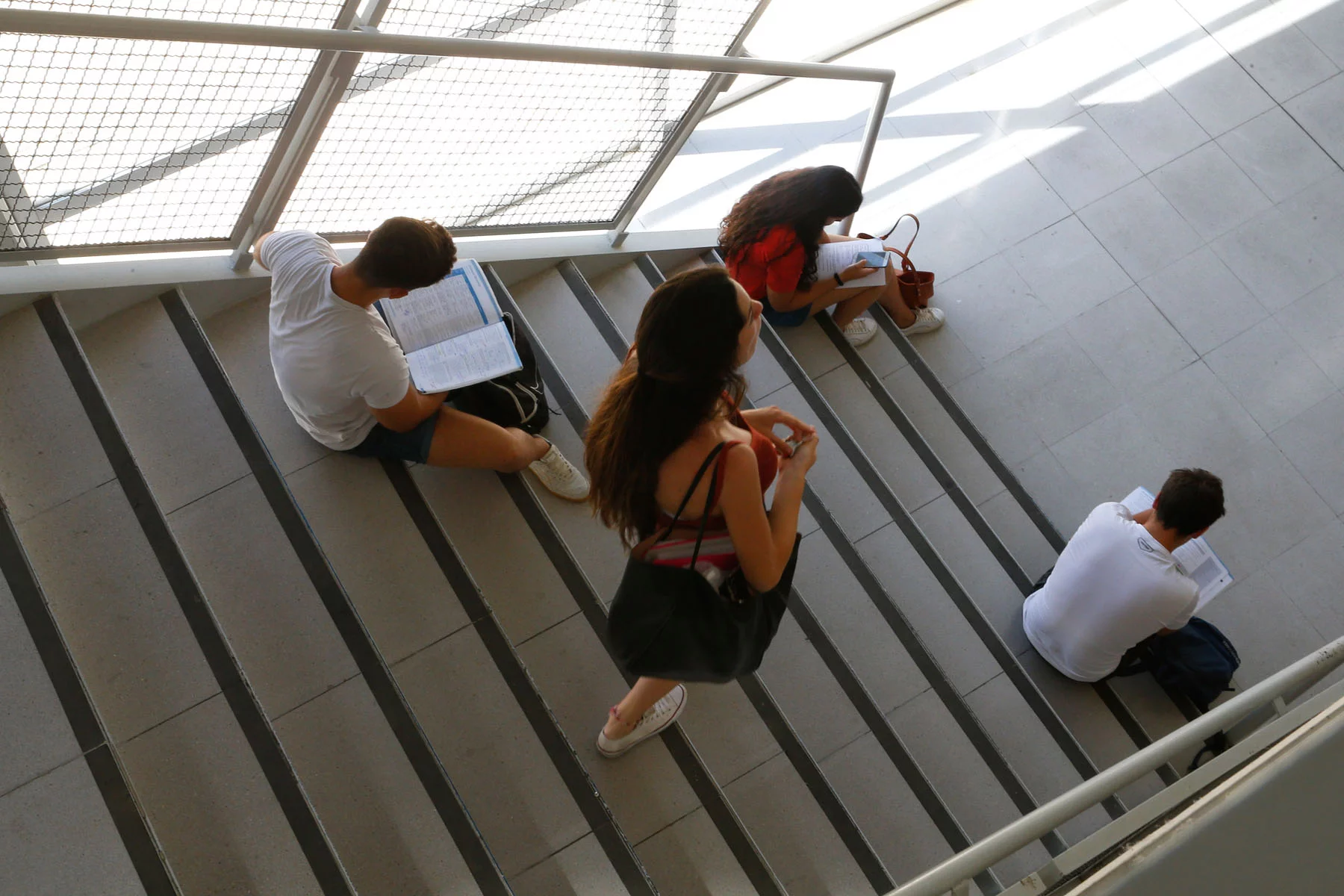 pupils studying on stairs in Mallorca, Spain