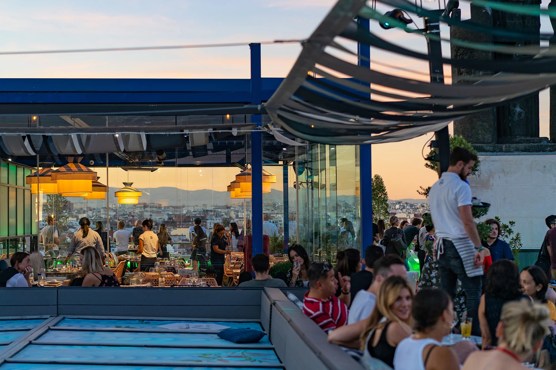 A rooftop bar in Madrid at sunset