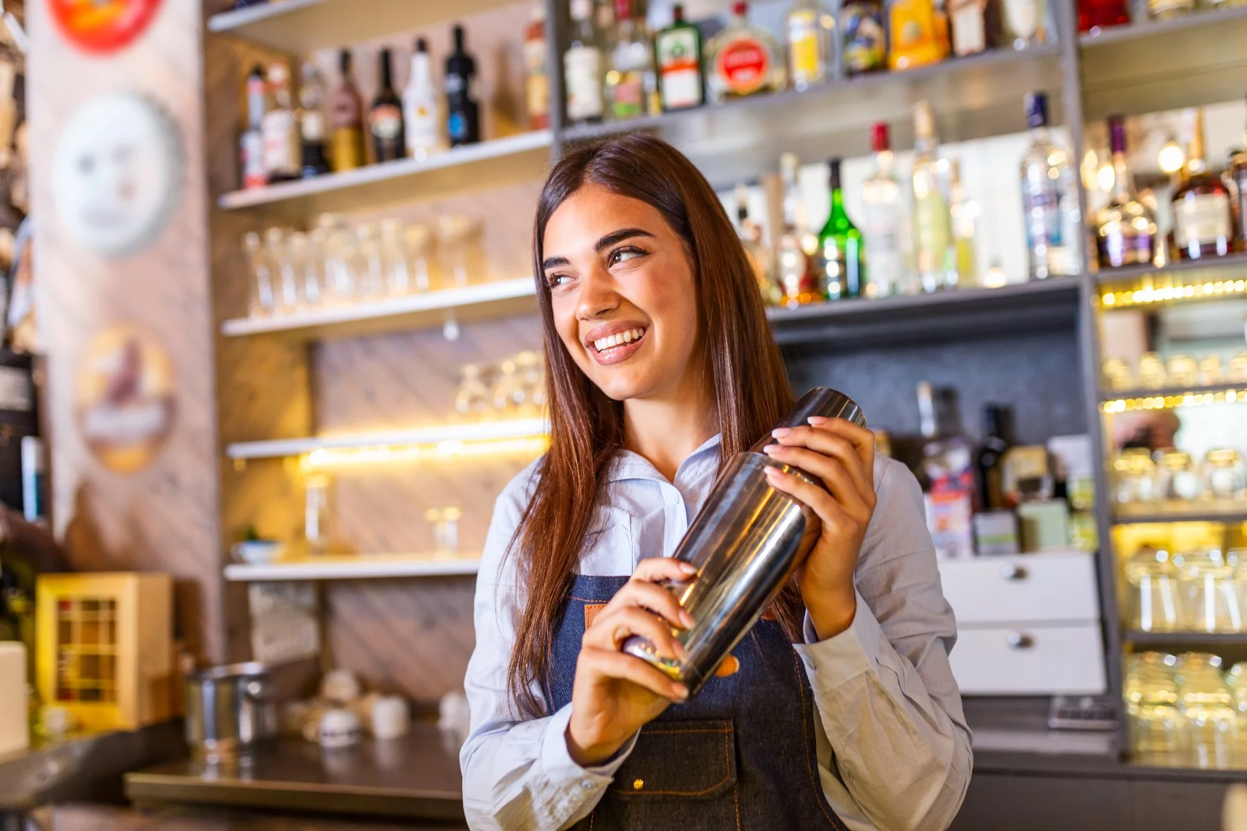 young woman service worker in Spain bar
