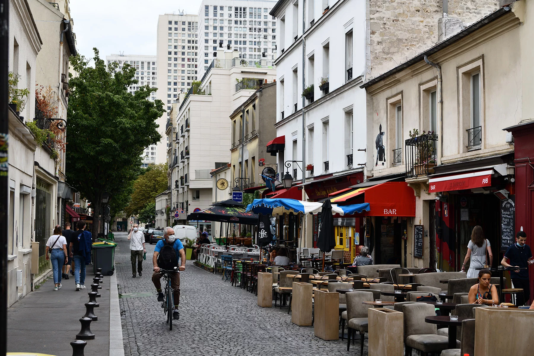 Cafés and shops lining a street in la Butte aux Cailles in Paris