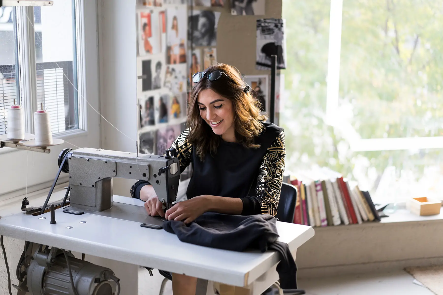 A designer working with a sewing machine