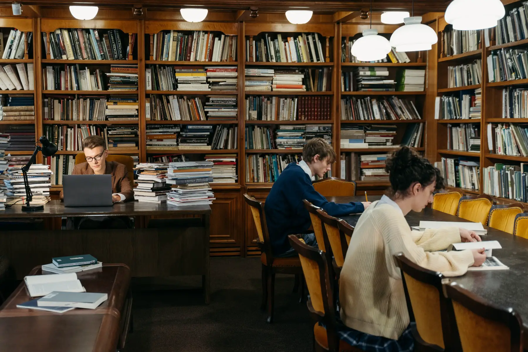 Students sitting in a library.