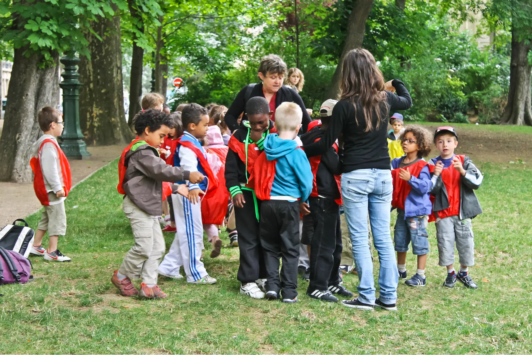French schoolgroup in a park with their teacher