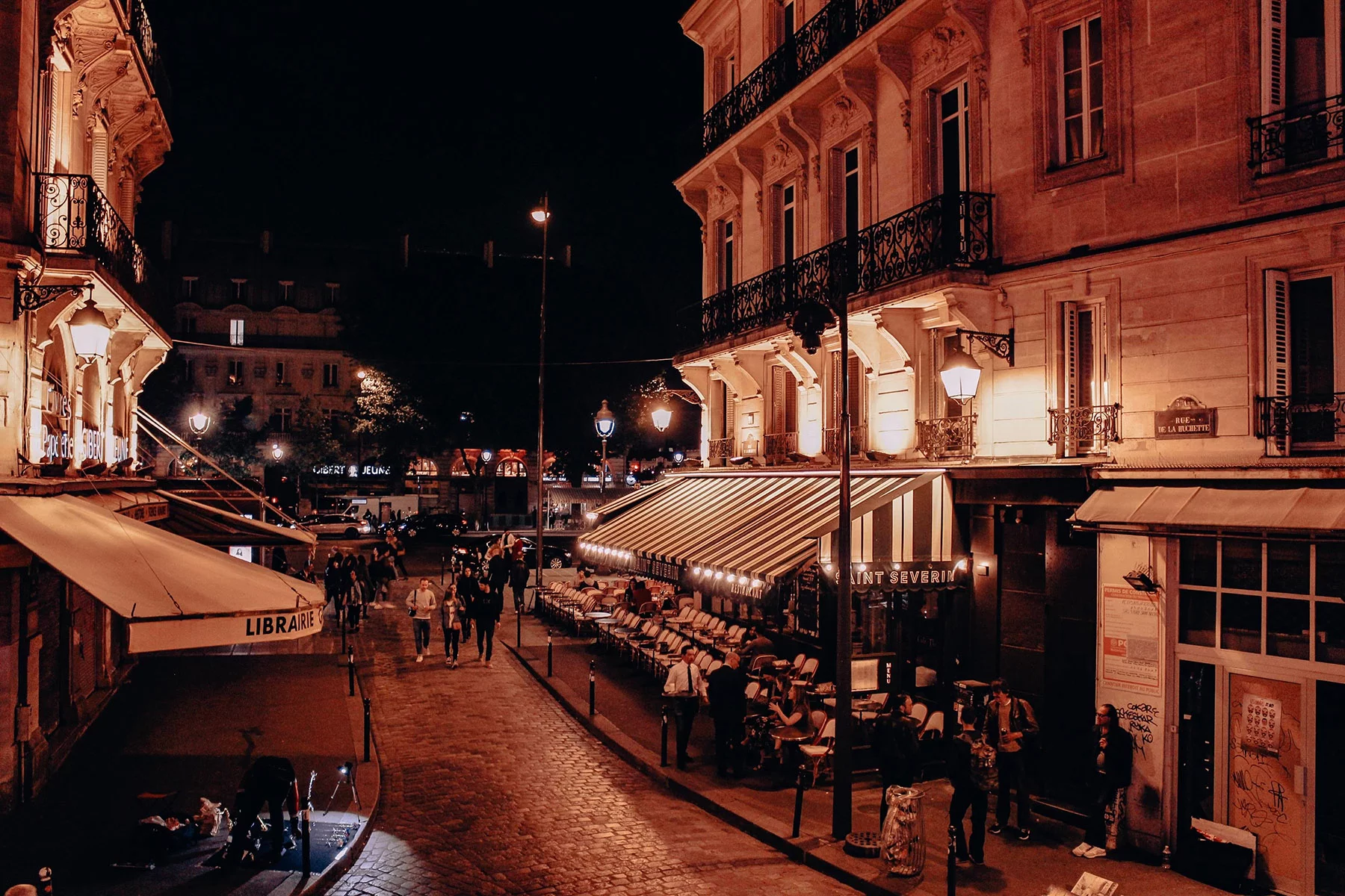 Street corner of the Latin Quarter of Paris, at night