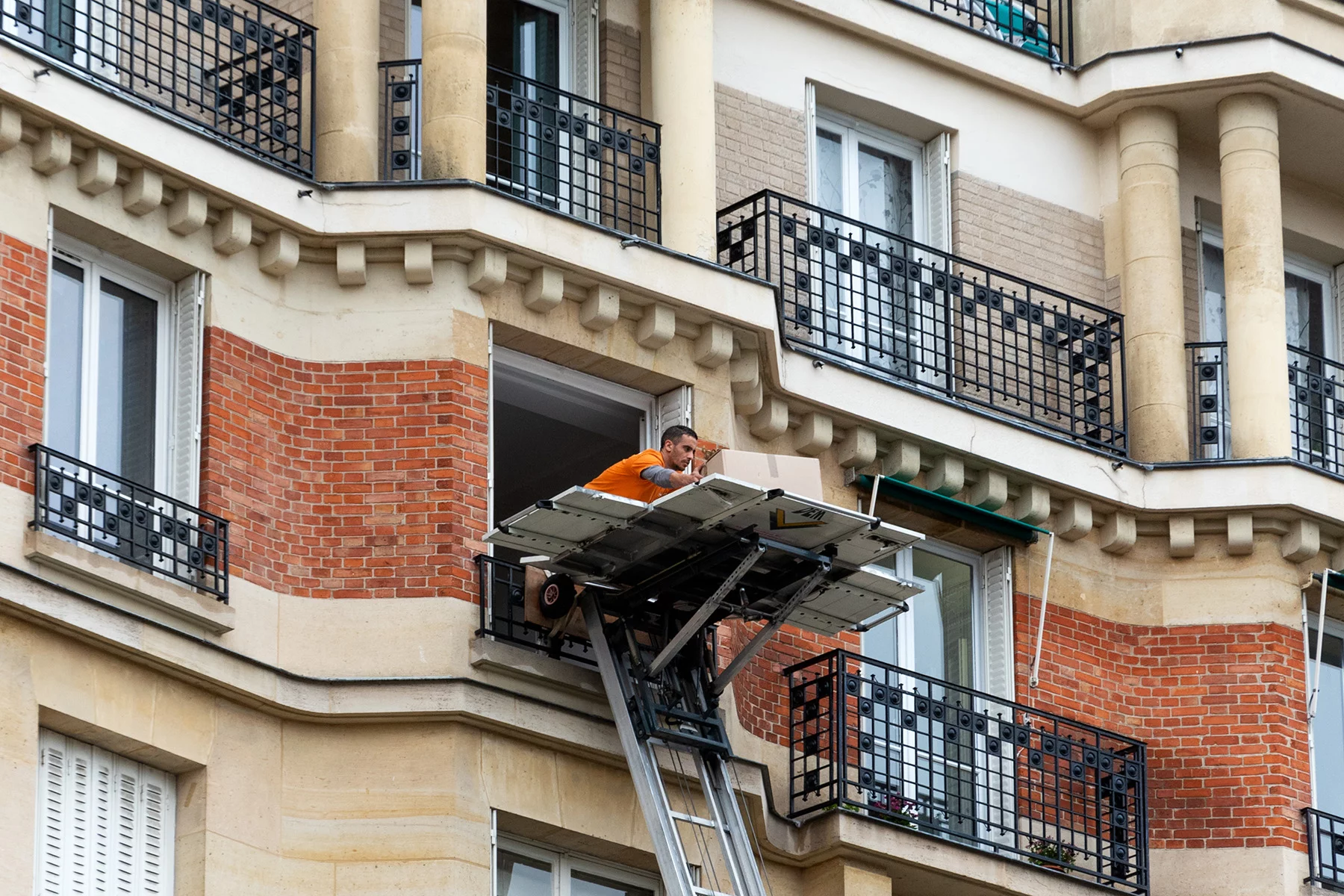 Moving company working at an apartment in Paris