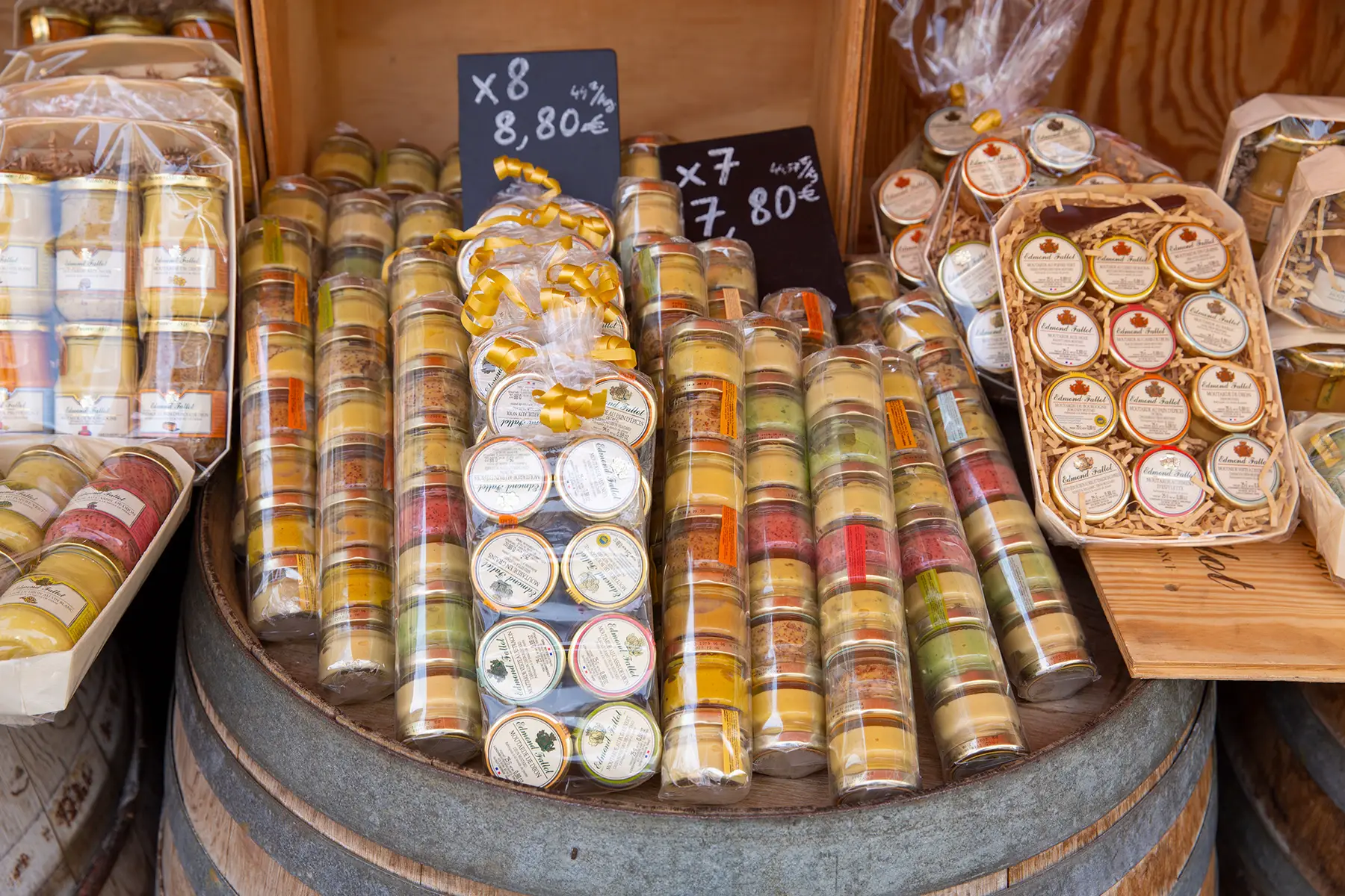 Different types of mustard on display in a shop in Dijon