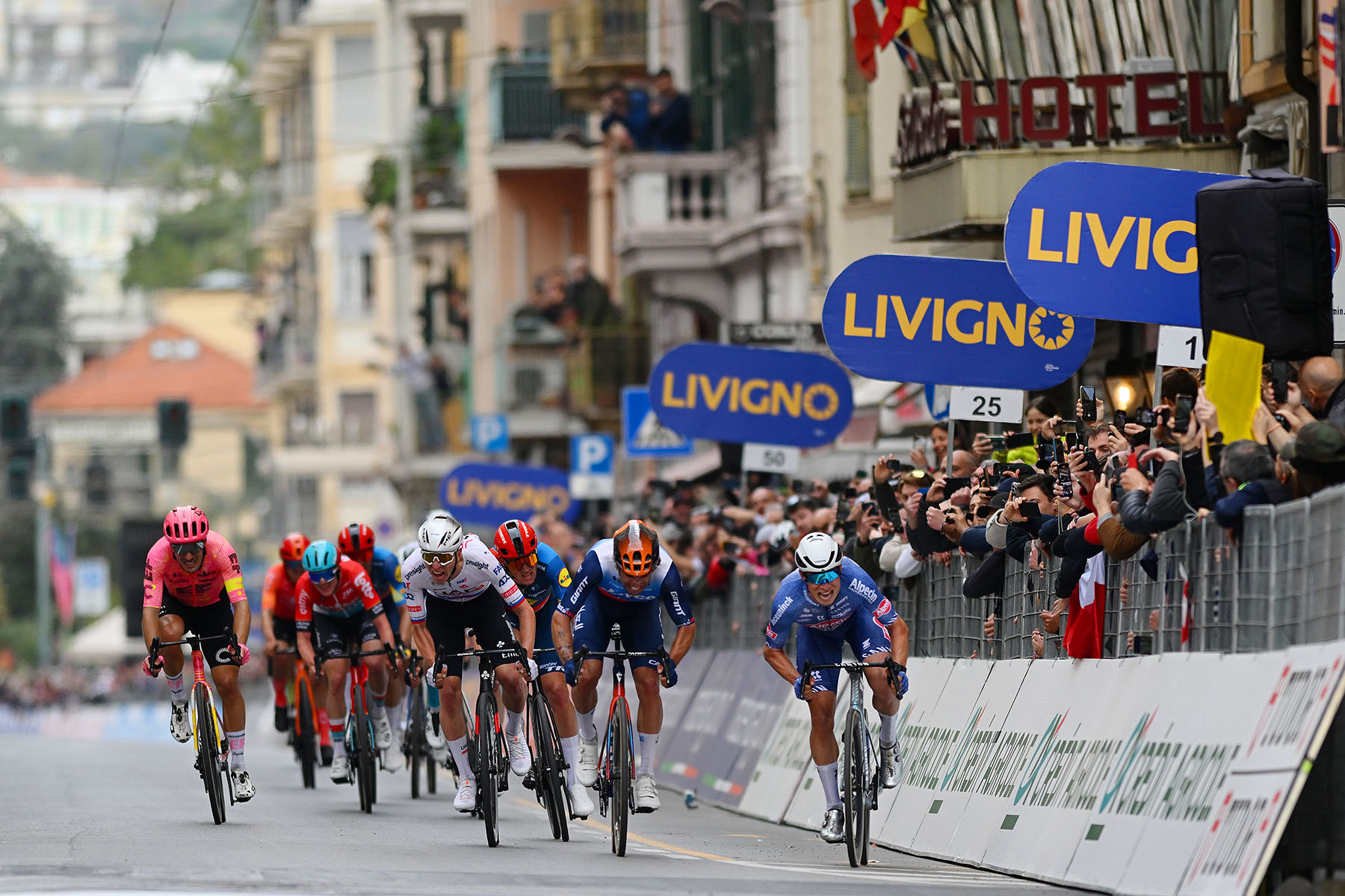 Professional cycling athletes competing in the 2024 Milano-Sanremo in Sanremo, Italy.