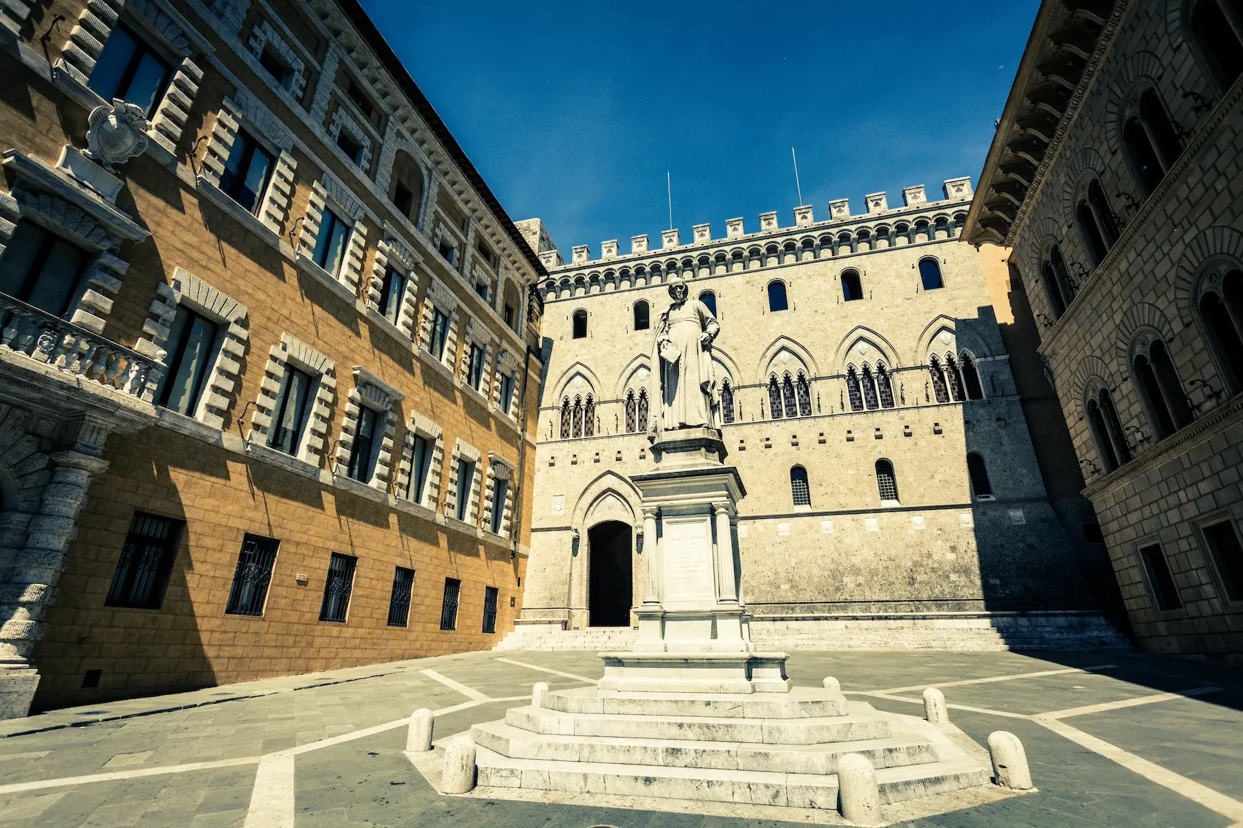 A statue in front of Banca Monte dei Paschi di Siena, the world's oldest bank