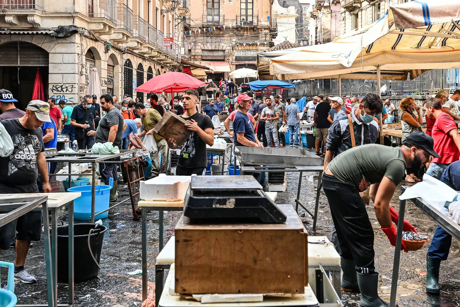 Crowds at a fish market in Catania, Italy