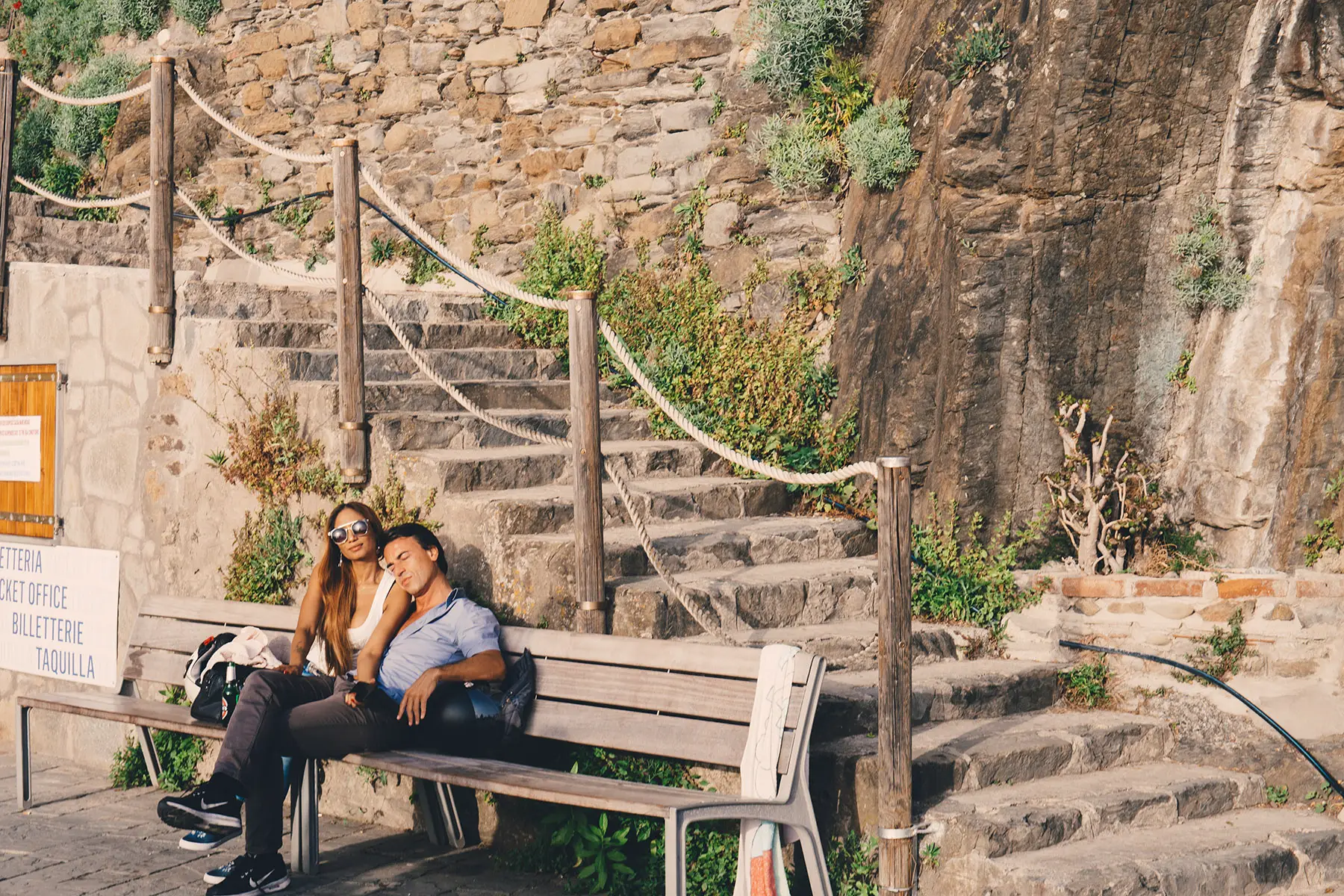 A couple on a bench in Cinqueterre, Italy