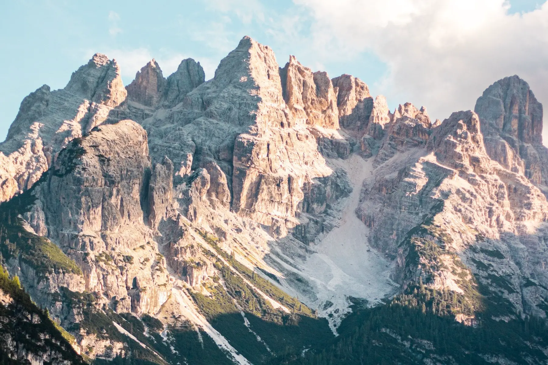 A long shot of the Dolomites lit up by the sun