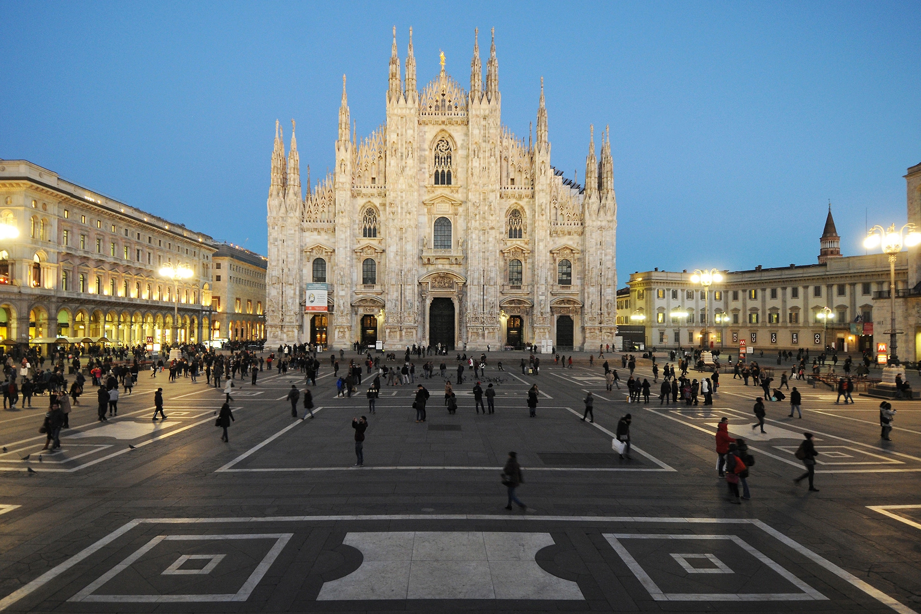 Duomo di Milano, a gothic cathedral in Milan with a busy square in front of it
