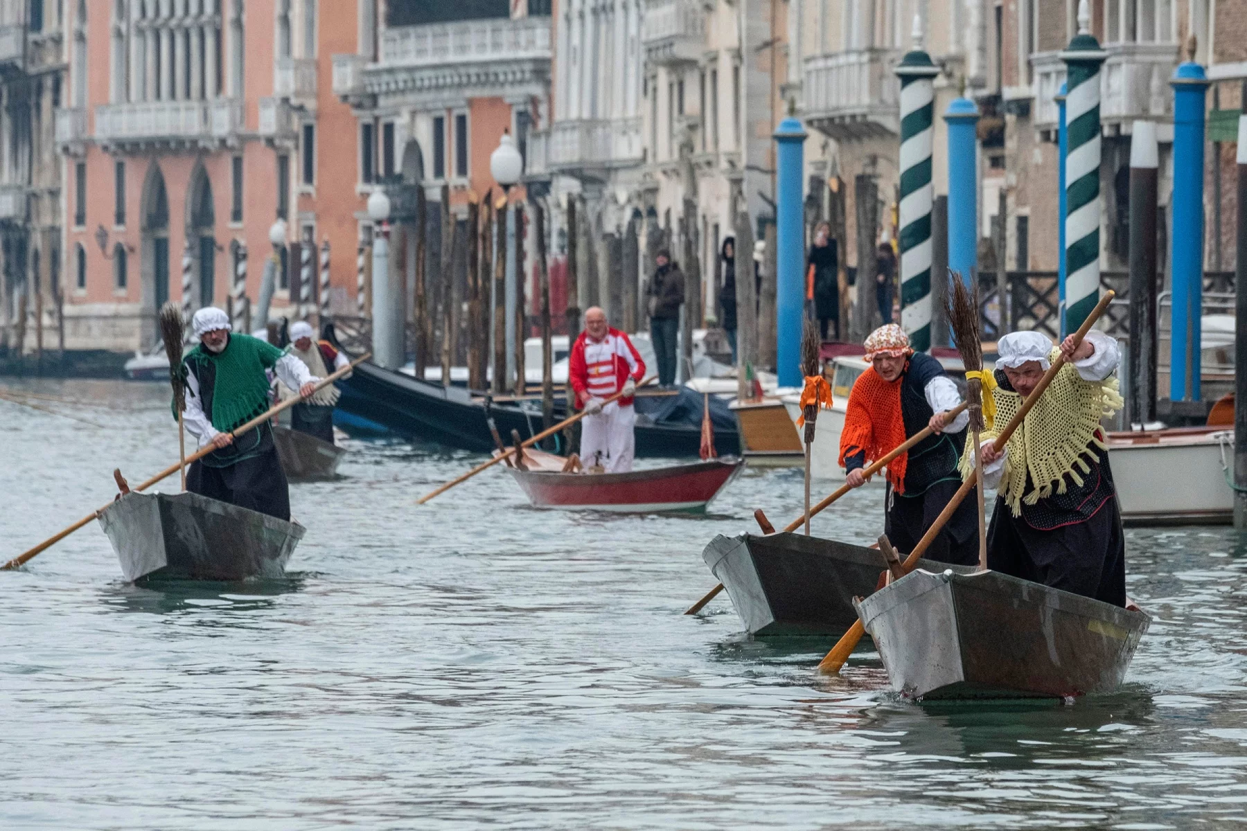 Five men participating in Befana Regatta in Venice