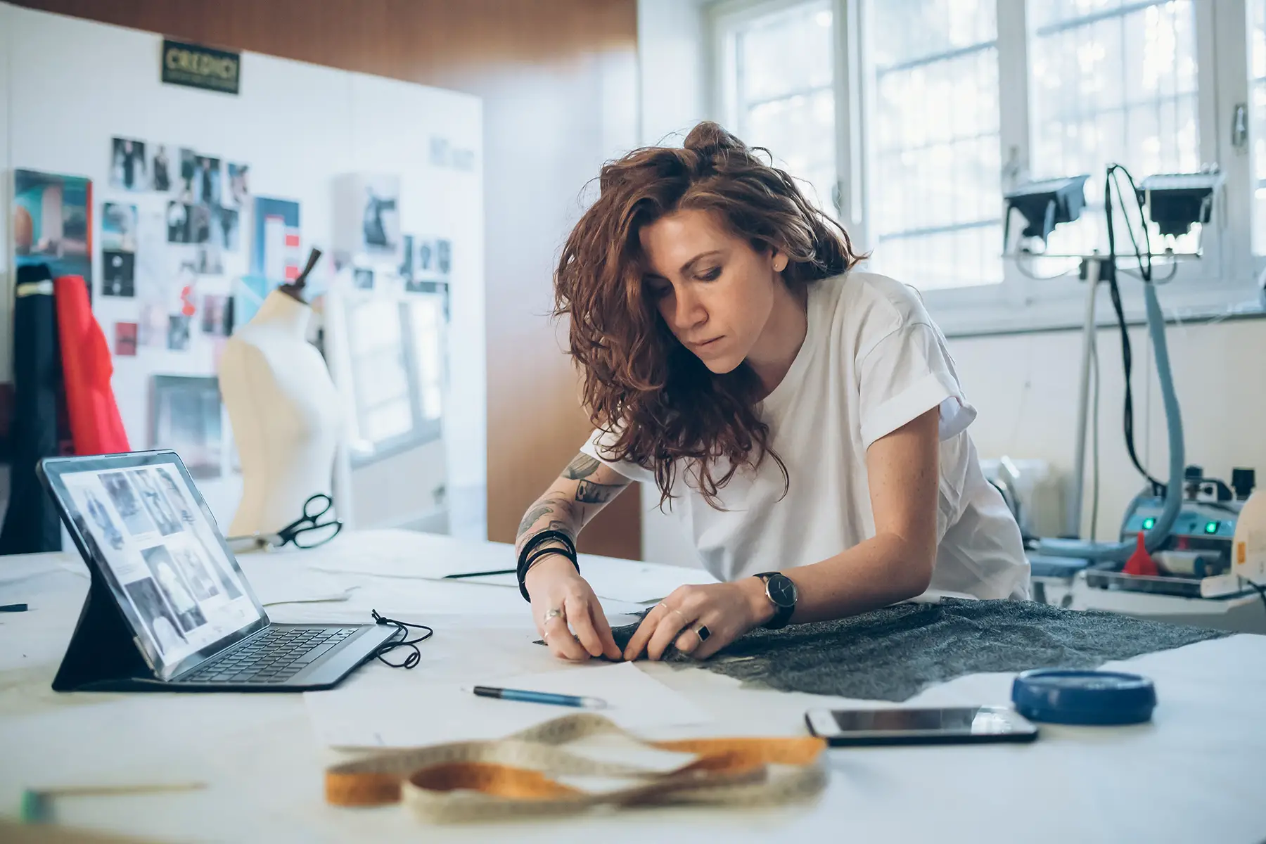 A fashion designer working at a desk