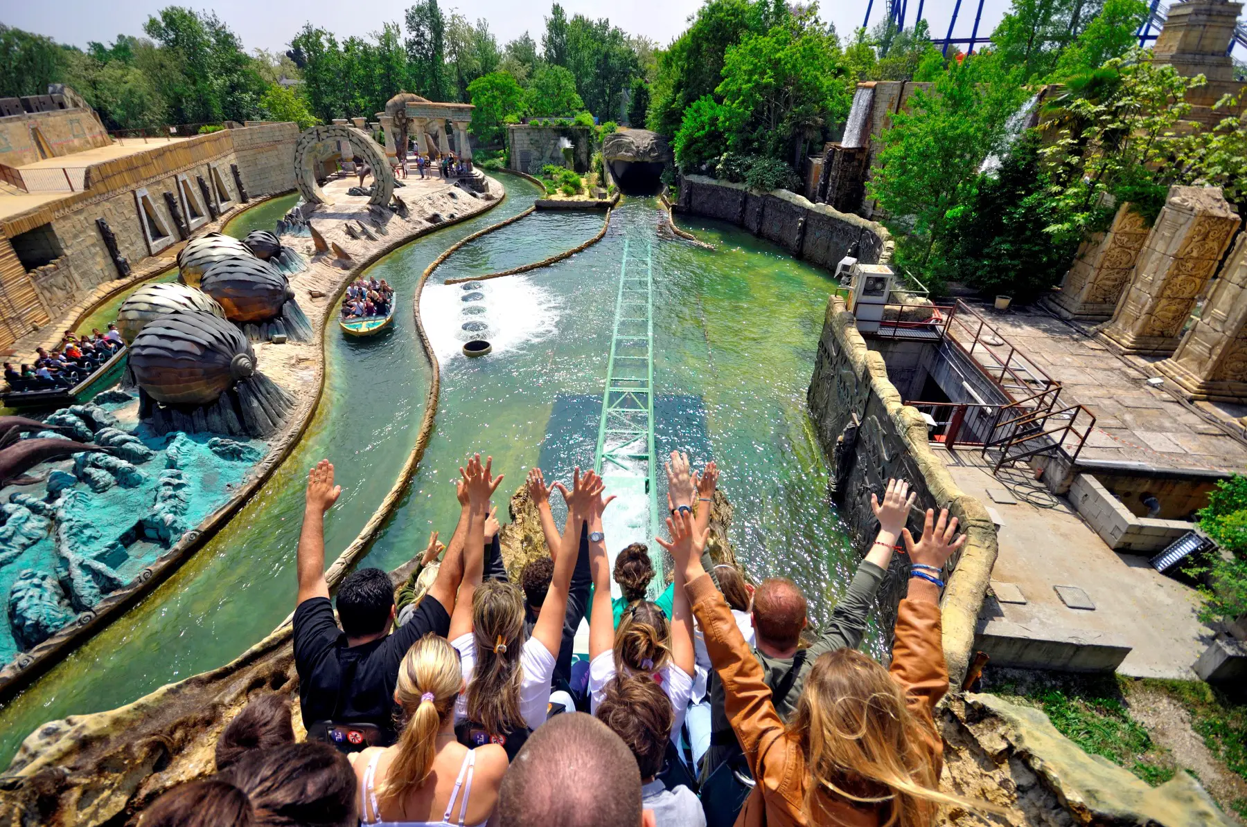 Visitors riding the Escape from Atlantis water ride at Gardaland Resort in Italy