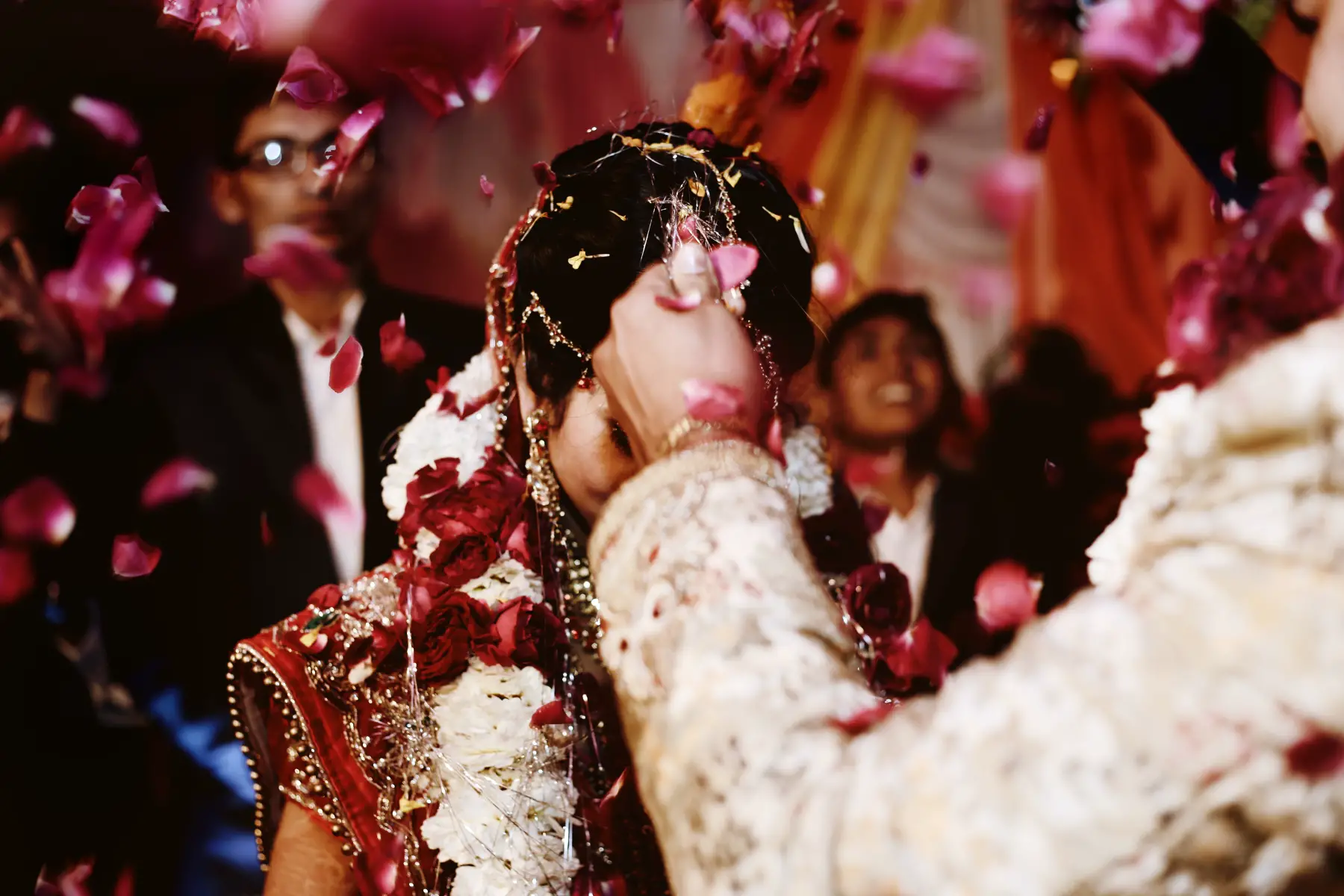 A bridal couple at a colorful Hindu wedding, Garland of Jaimala ceremony