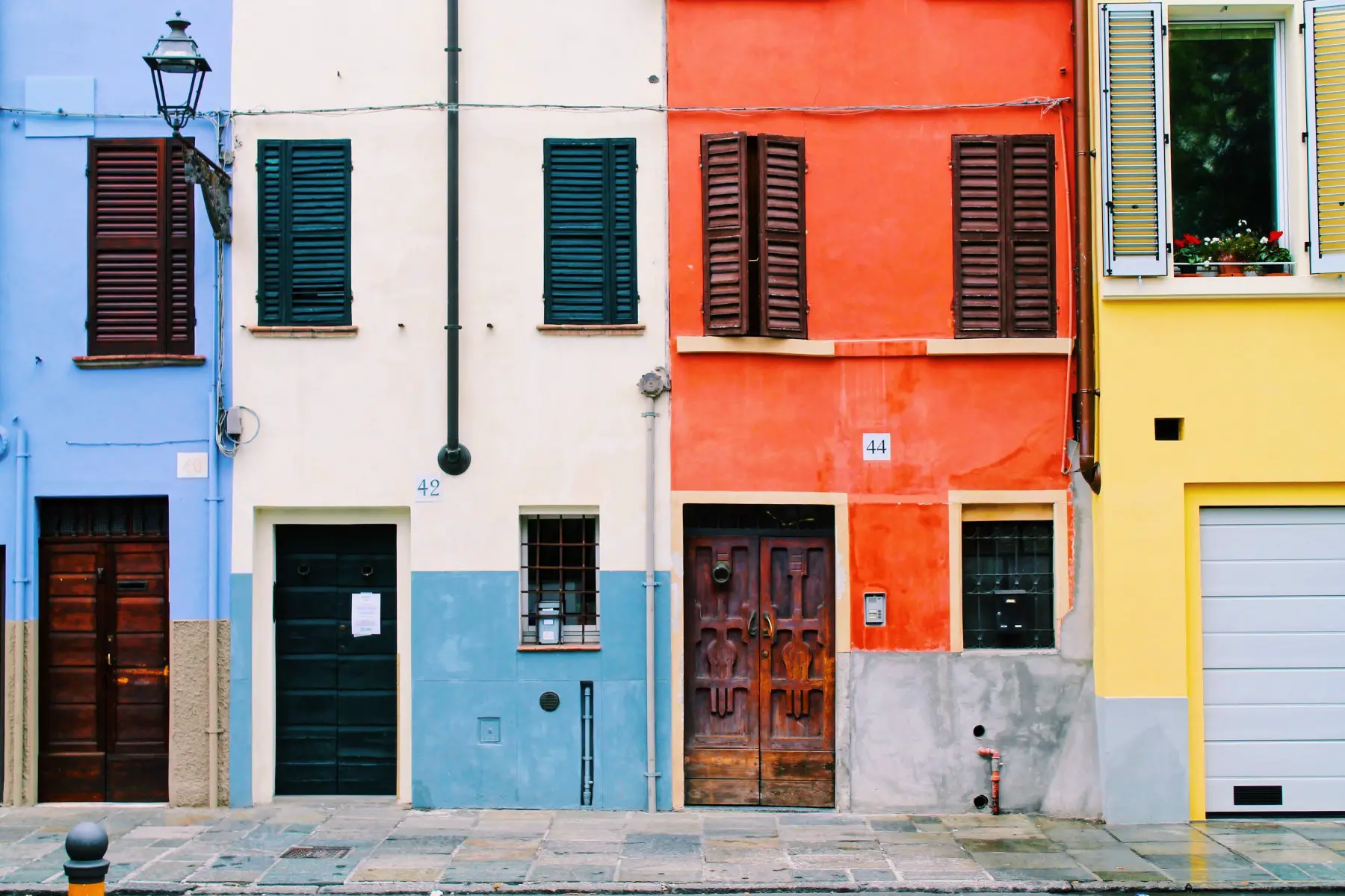 Colorful houses on a street in Parma, Italy.