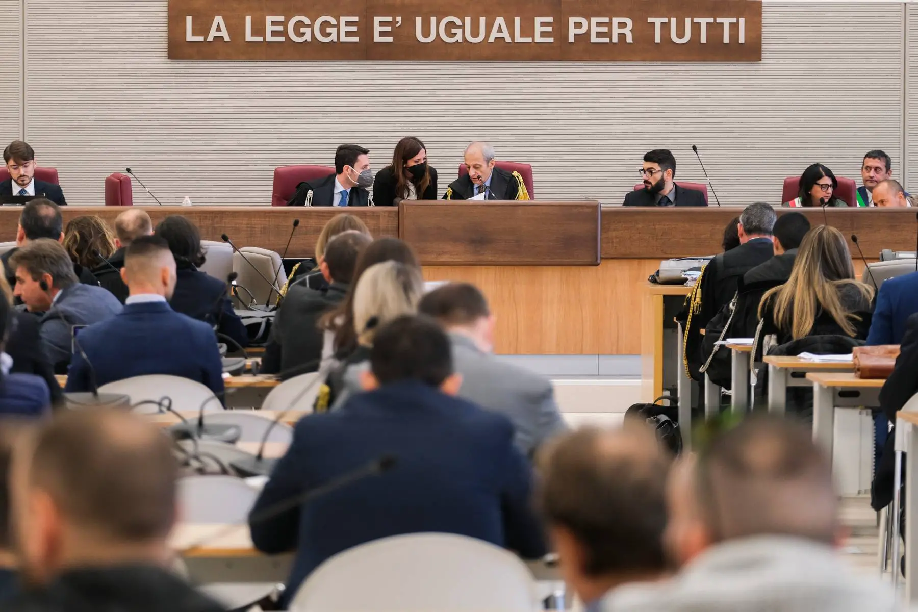 President of Assizes Court, Roberto Donatello (C), chairs the first hearing in the trial for tortures that took place in the Francesco Uccella prison. Above the judges, it reads 