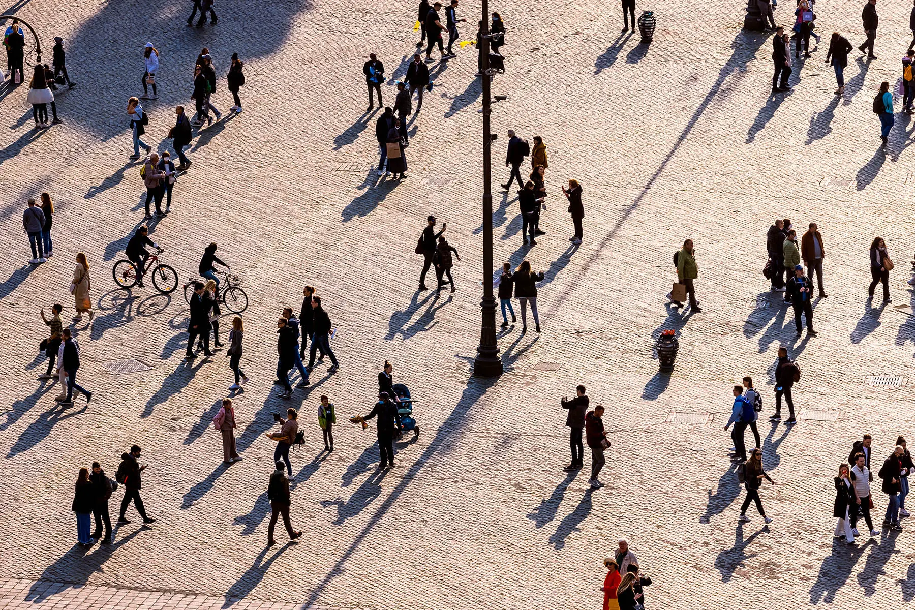 Aerial view of people crossing a piazza in Rome, Italy