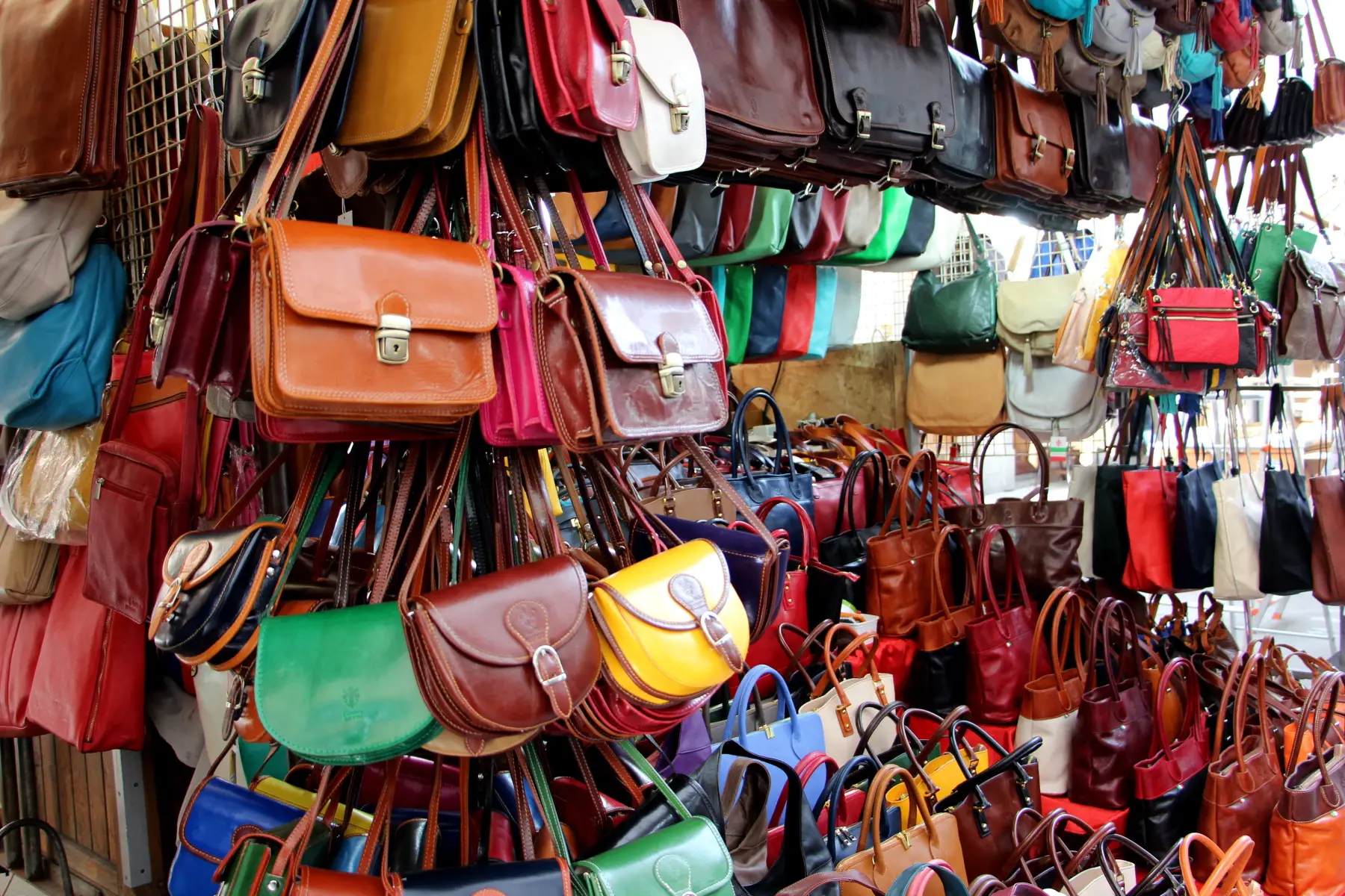 Colorful leather handbags at the leather markets of San Lorenzo, Florence, Italy