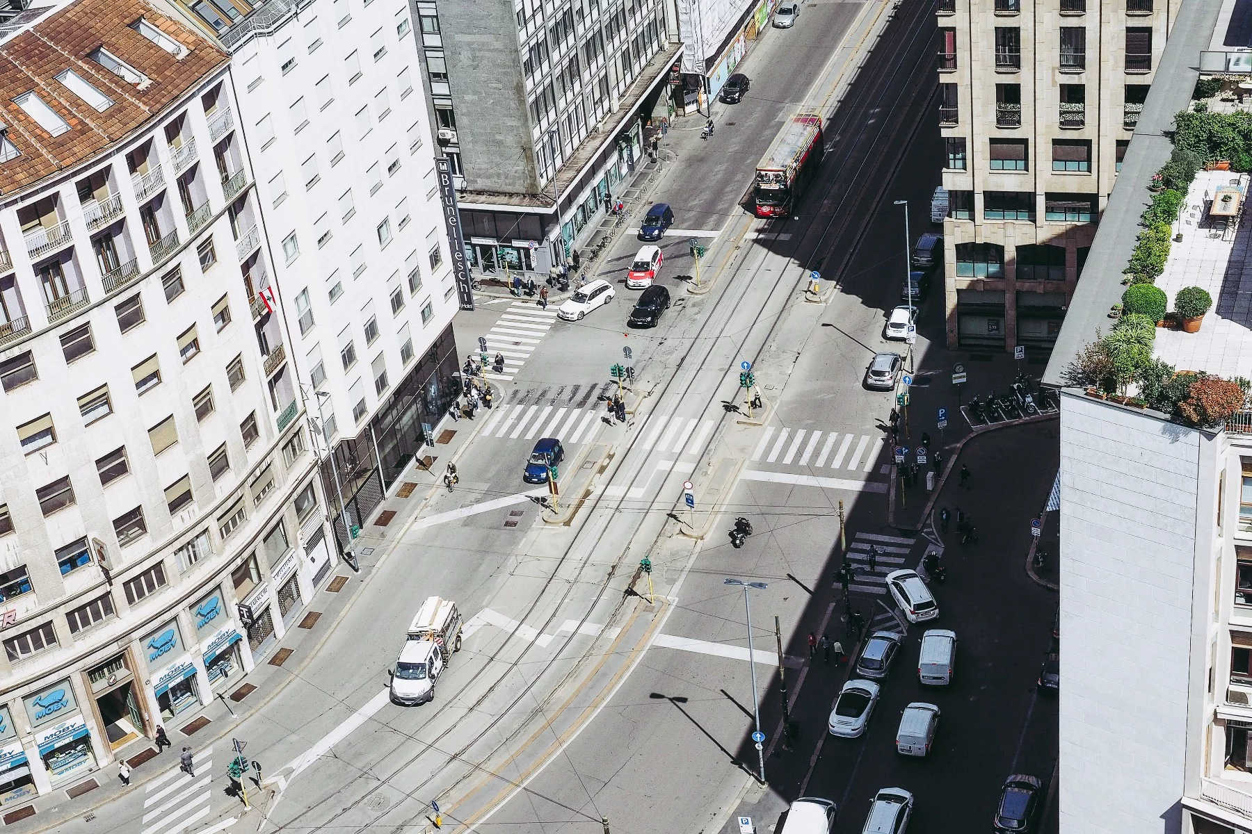 High angle view of street with cars amidst buildings in Milan, Italy