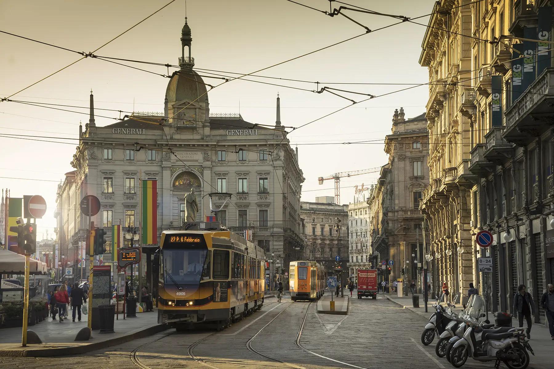 A tram in Piazza Cordusio, in the centre of Milan at sunset