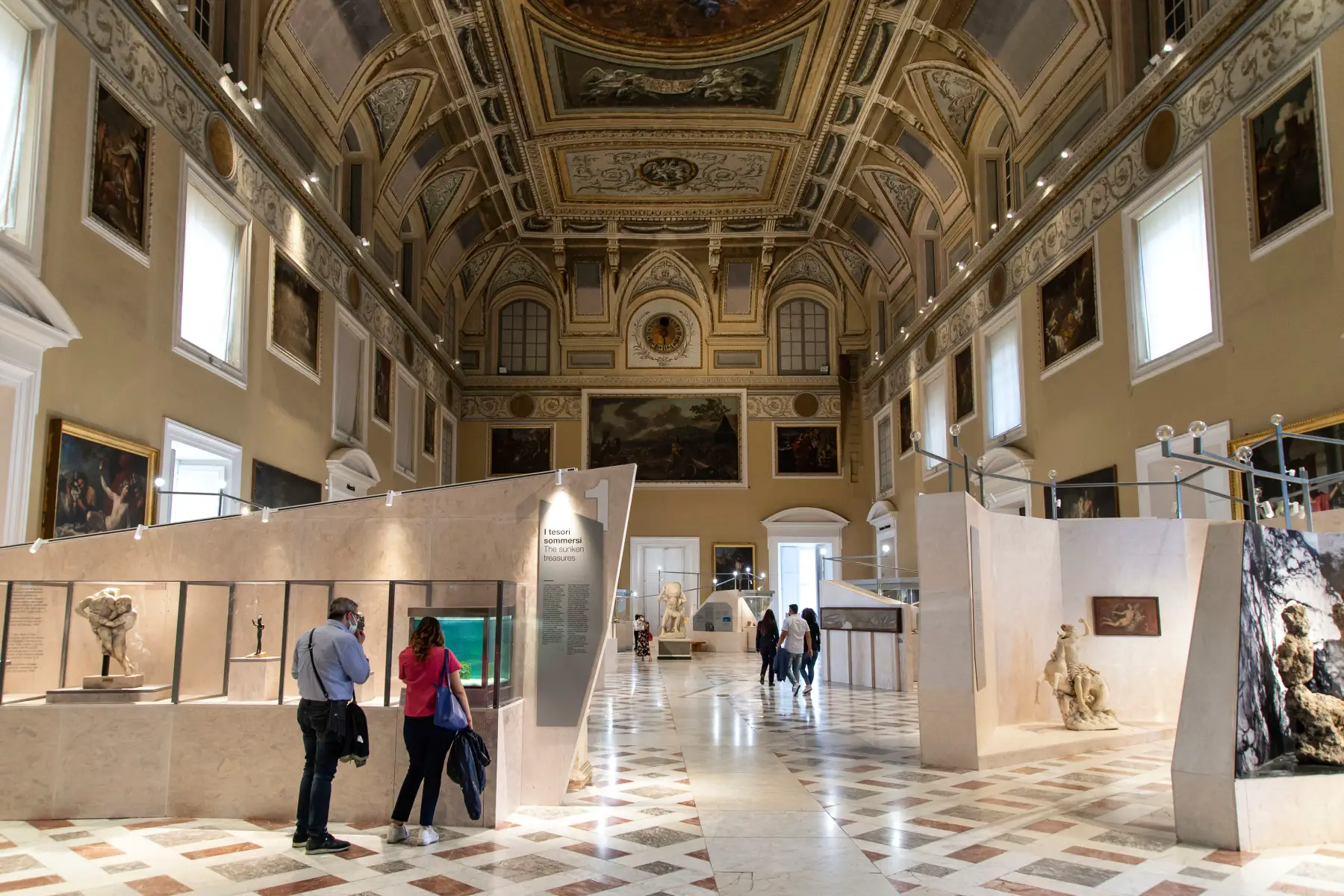 Visitors looking at the exhibitions at the Naples National Archaeological Museum.