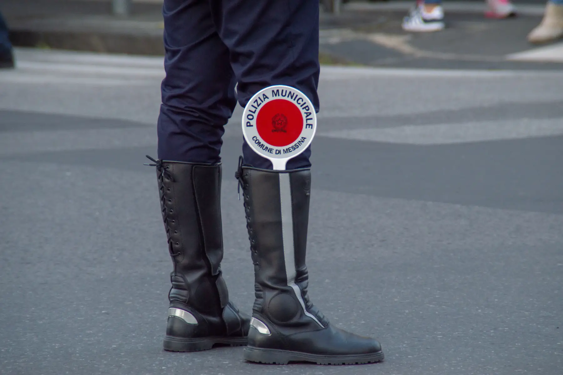 A close up of the leg of a police officer wearing a 