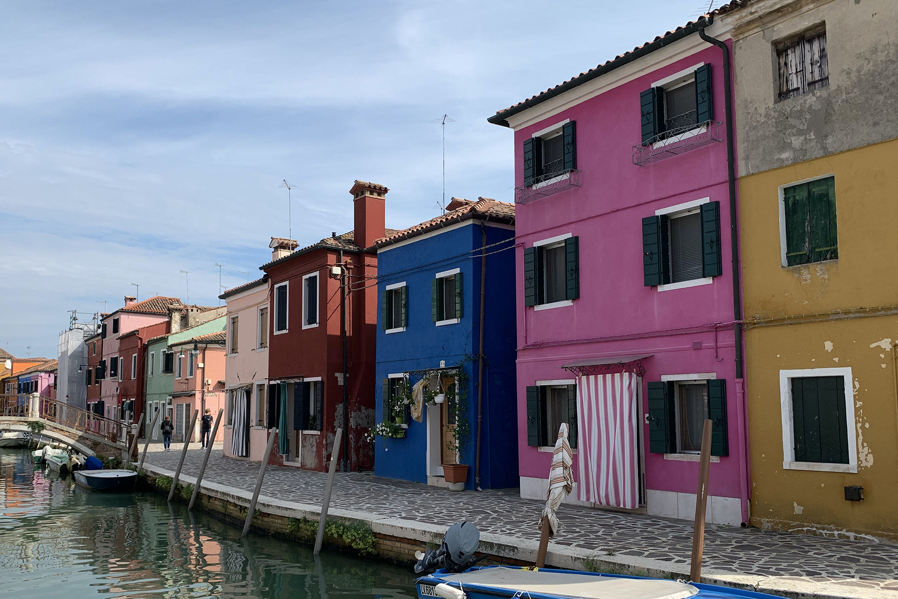 A selection of colorful houses along a canal