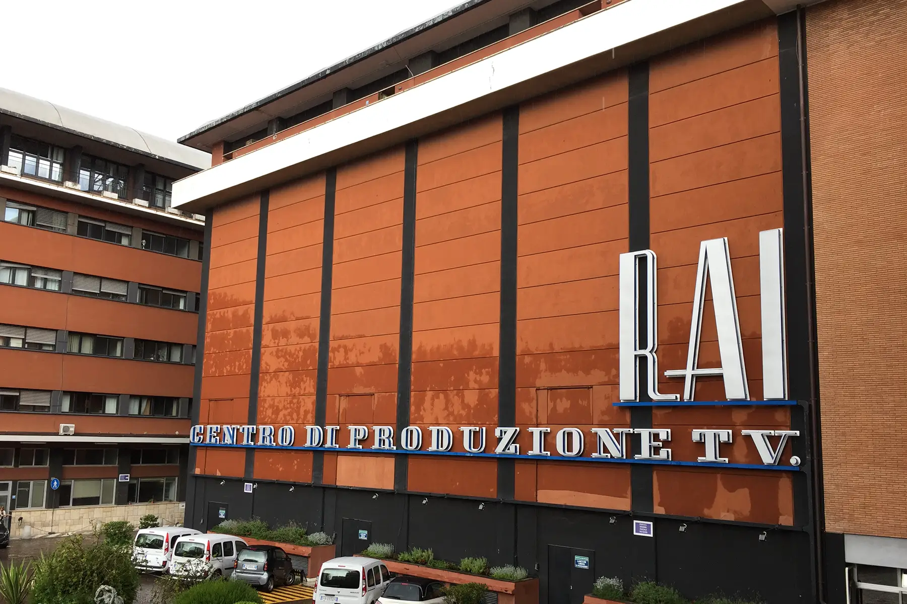 A big brown building with large art-deco lettering: RAI Centro di Produzione TV