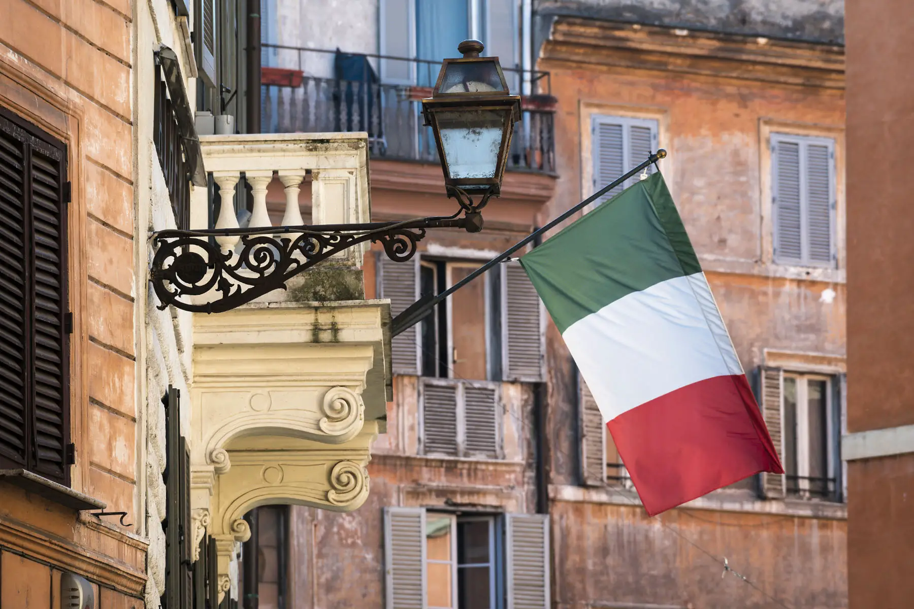 The Italian flag flying outside on a street near Campo di' Fiori in Rome, Italy.