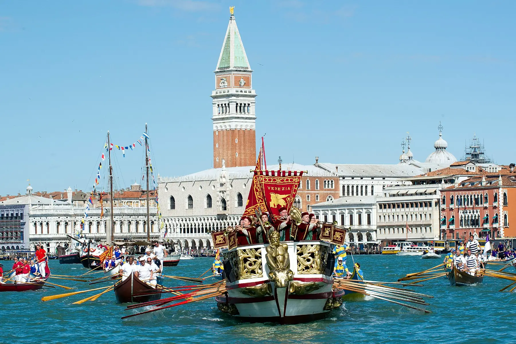 Serenissima boat sailing in front of the Doge Palace during the Sposalizio del Mare in Venice
