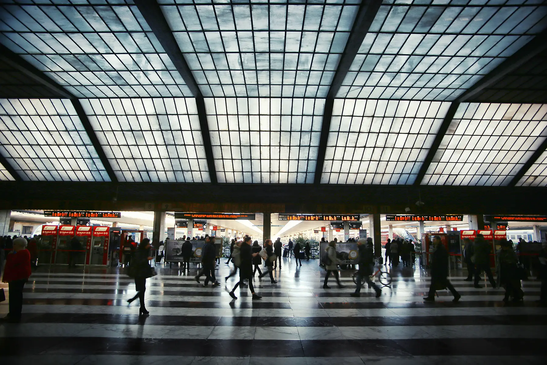 Main lobby full of commuters at Santa Maria Novella Railway Station in Florence, Italy.