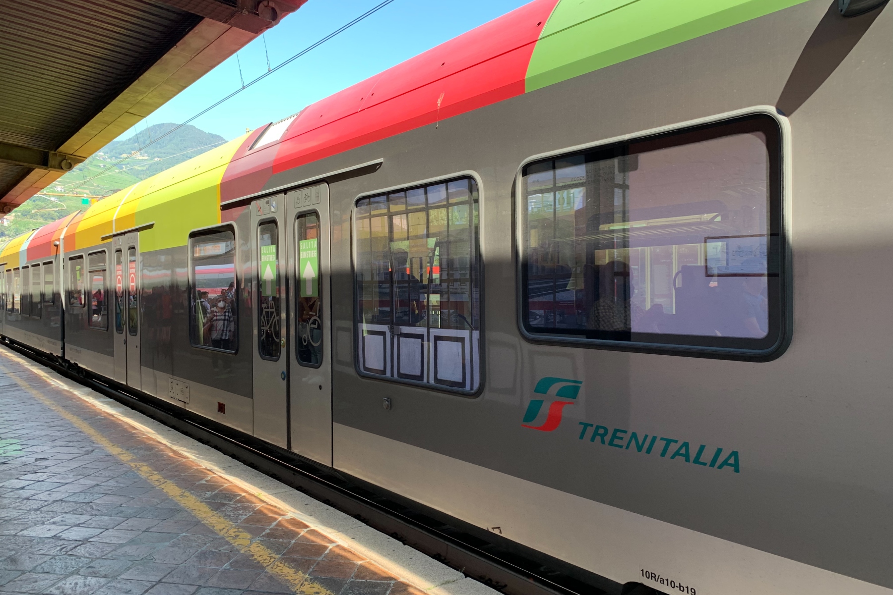 A Trenitalia train is pulled into Bolzano station