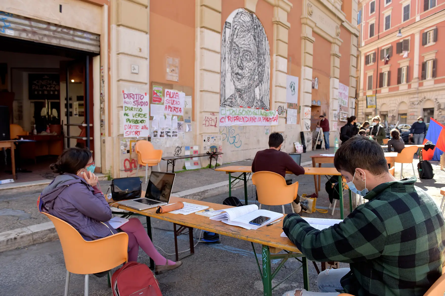 University students in Rome studying outside