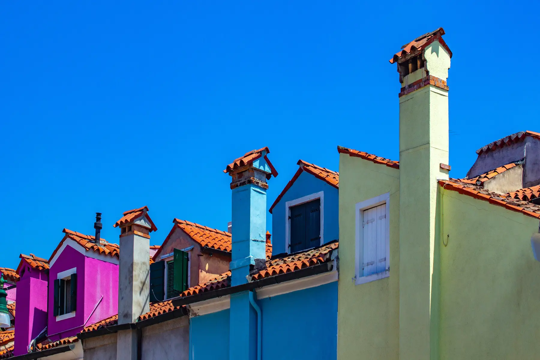 Colorful houses with chimneys in Venice