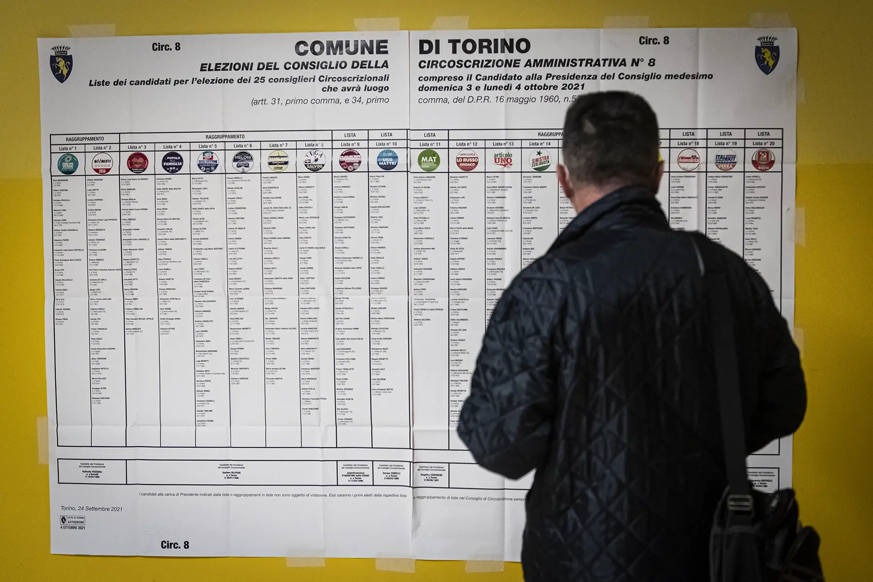 Voter consults a voting board during the 2021 mayoral election in Torino