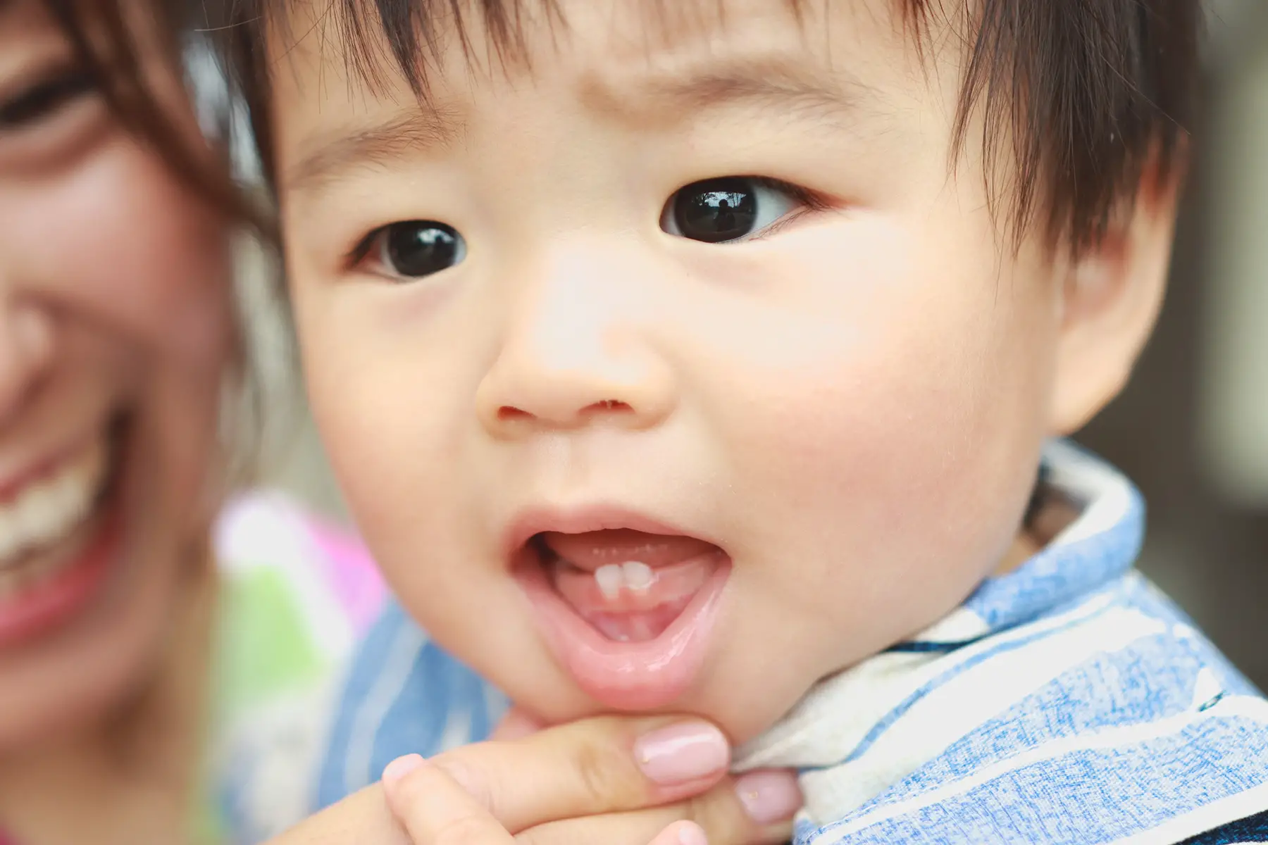 Close-up of a baby with two teeth