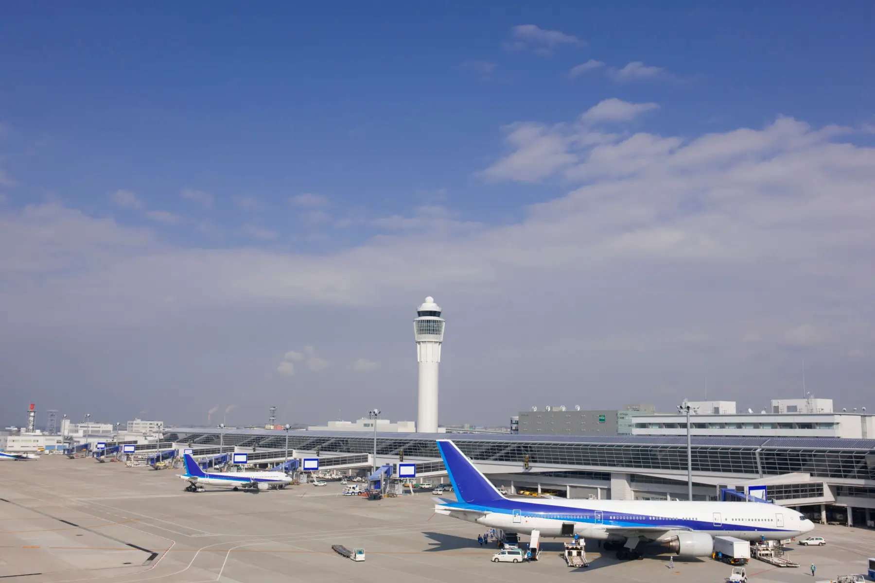 an external shot of two planes lined up at the terminal at Chubu Centrair International Airport 