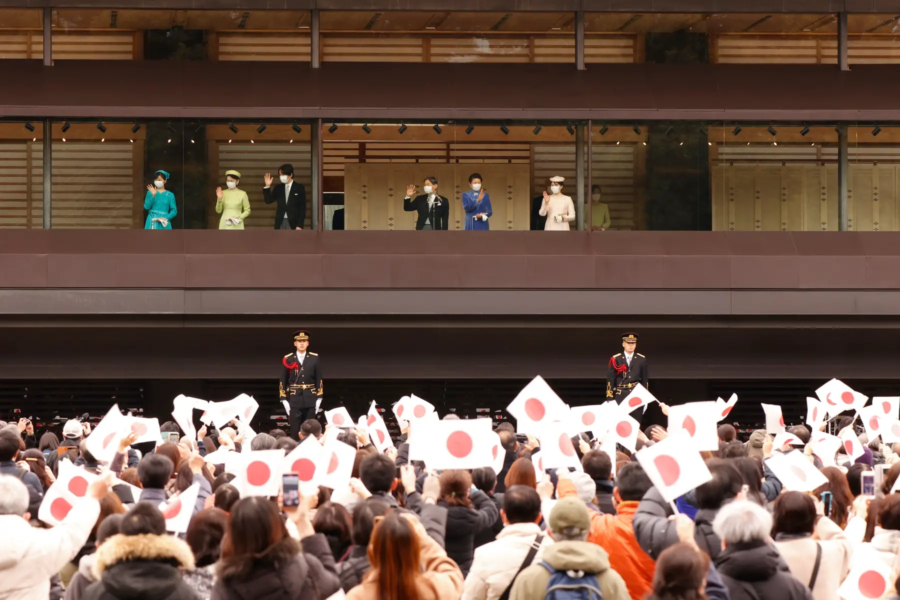 Crowd waving Japanese flags gather for Emperor Naruhito's birthday in Tokyo