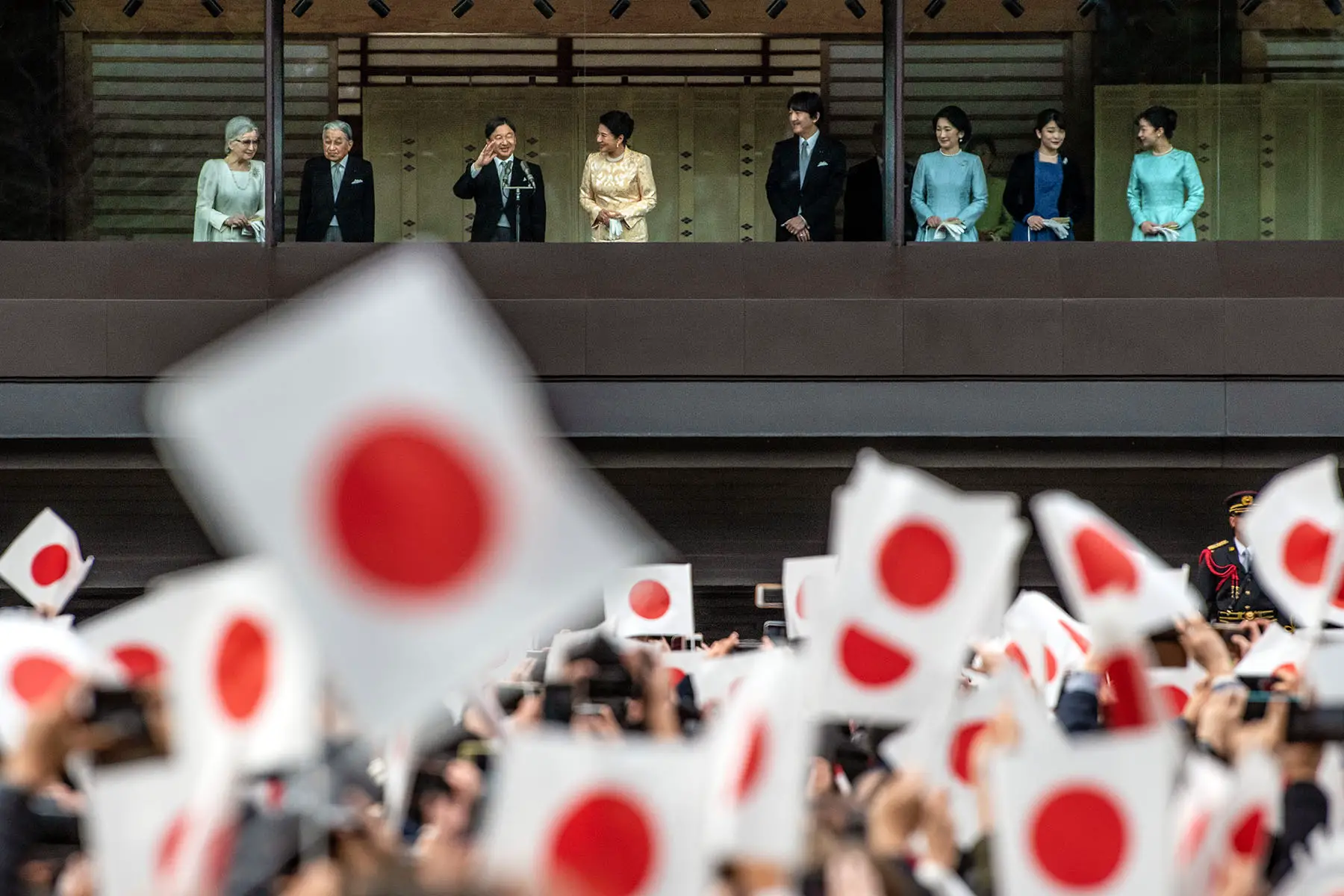 Emperor Naruhito waves at the people during a traditional New Year's greetingin 2020 at the Imperial Palace in Tokyo, Japan.