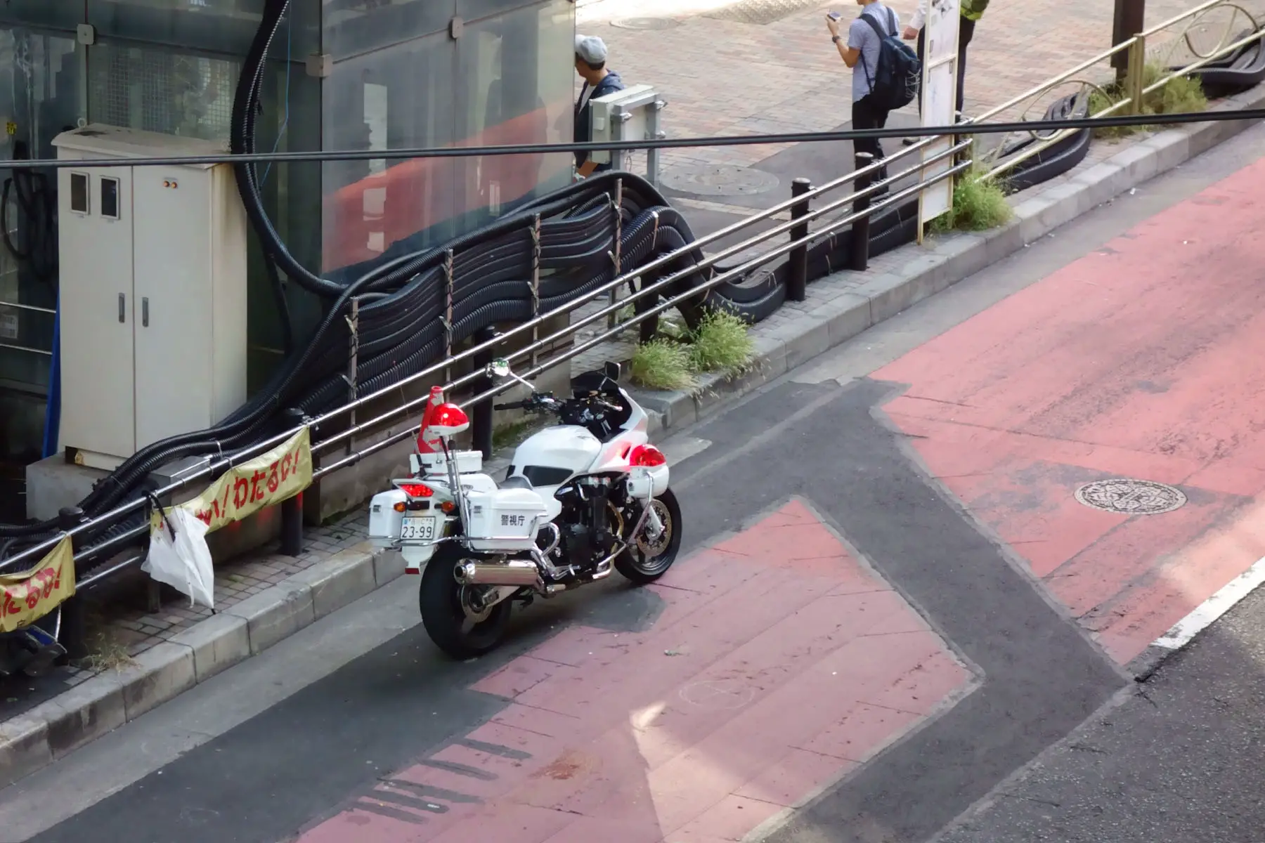 Japanese police motorcycle parked on the road.