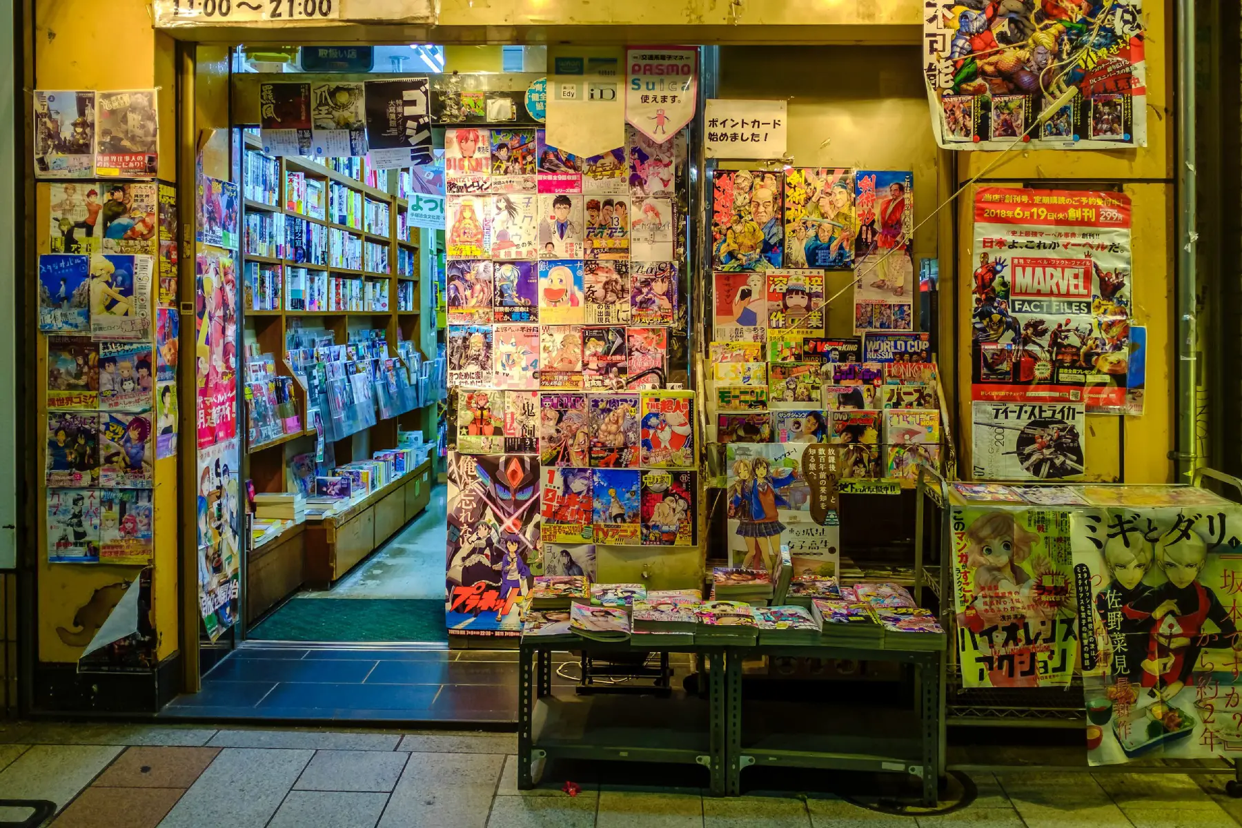 Exterior of a comic book shop with comics on display in Tokyo