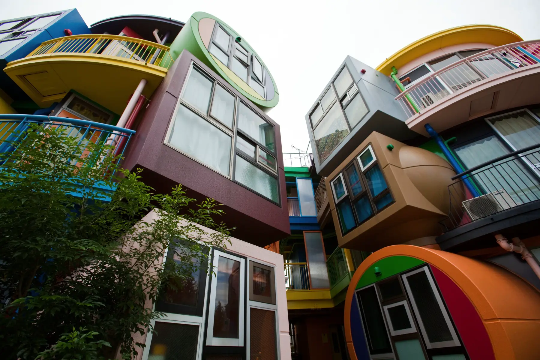 Exterior of Reverse Destiny Loft Apartments, designed in the style of a children's playground